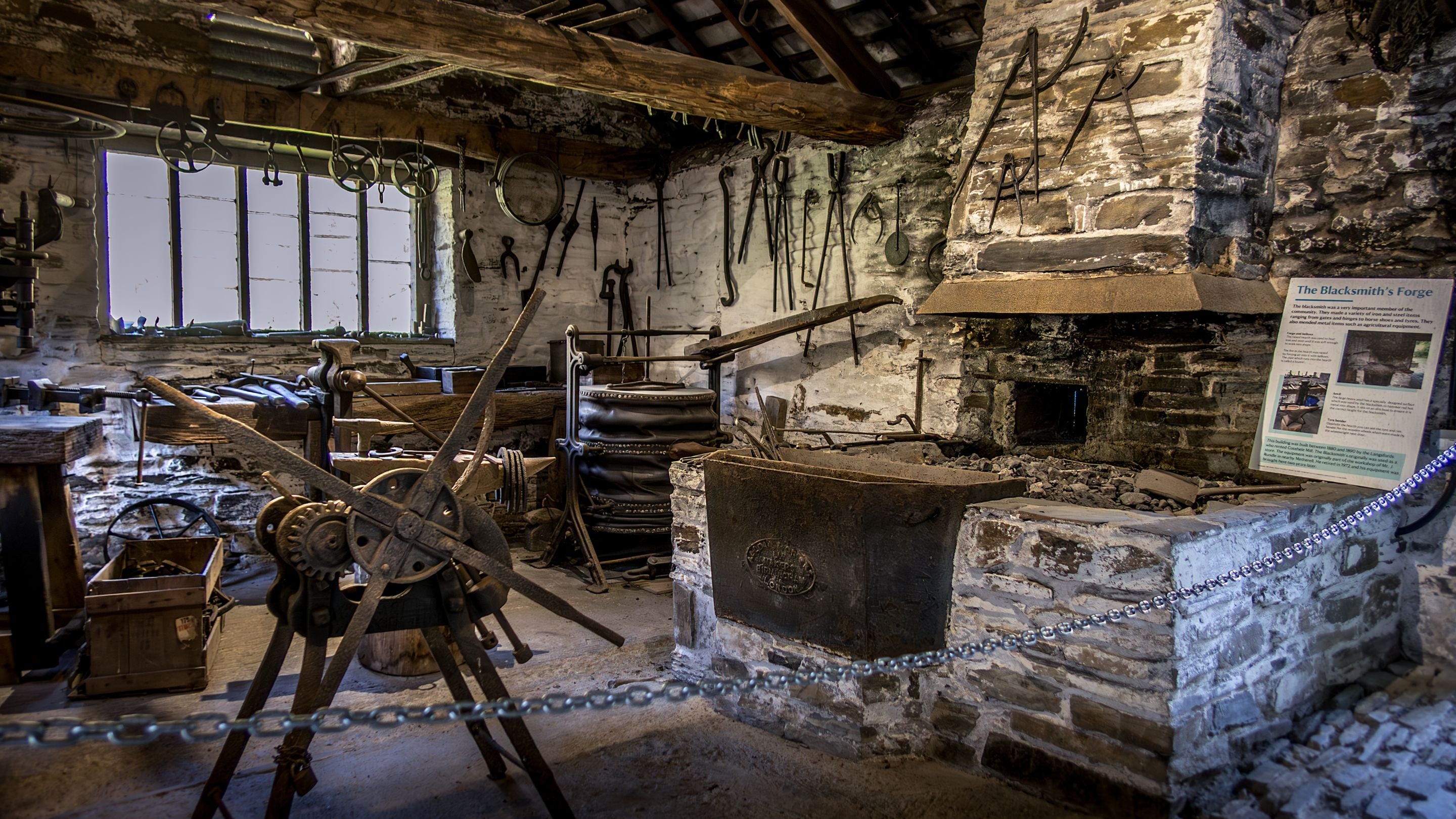 The recreation of a blacksmith's workshop near Cotehele Mill and Miller's House, Cornwall