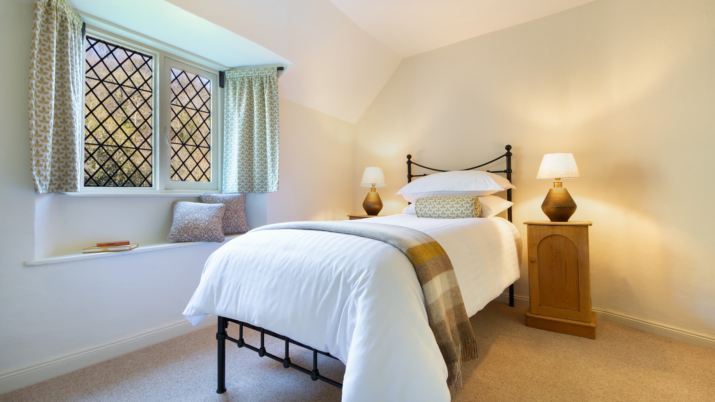 One of the single bedrooms, with a window seat, at Miller's House, Cornwall
