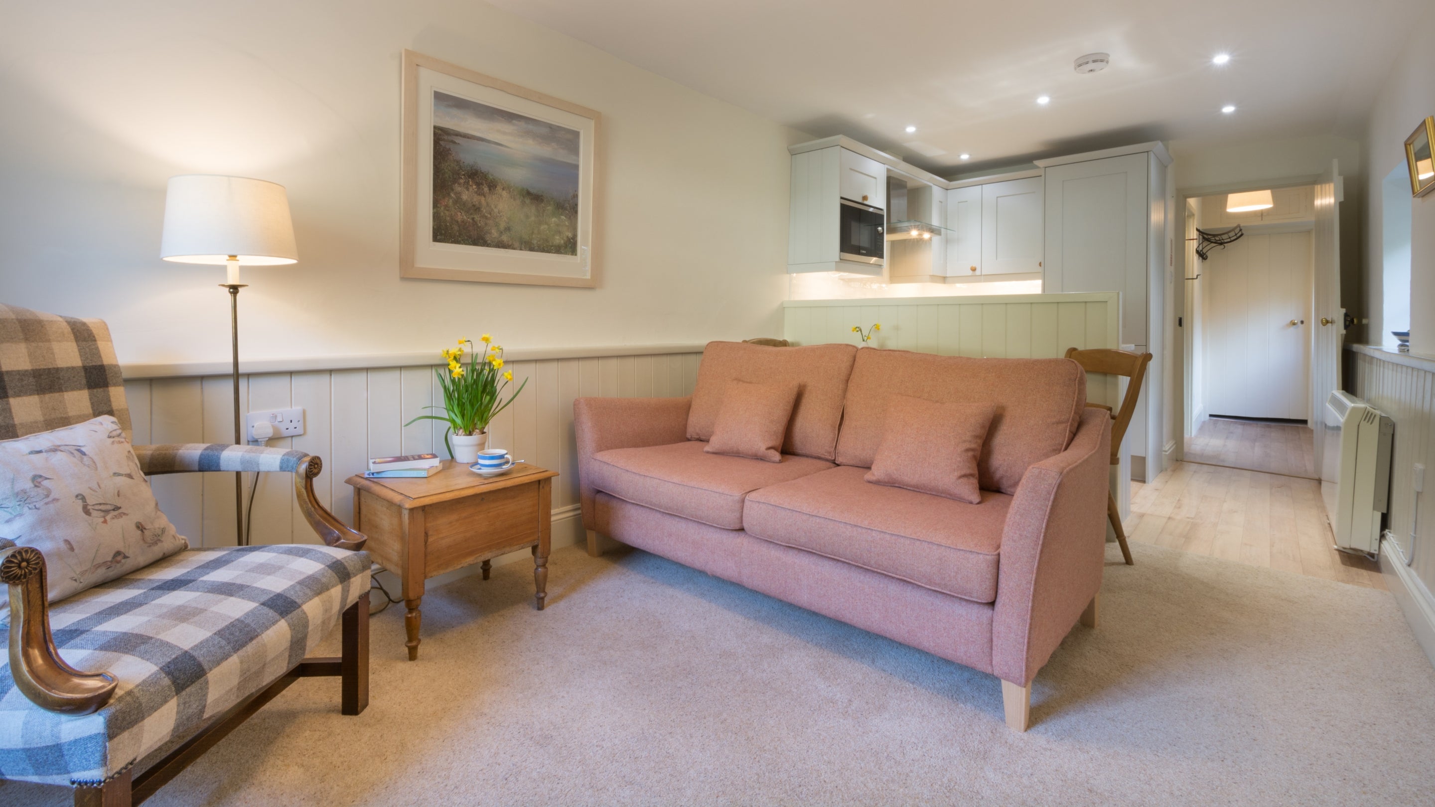 The sitting room and kitchen at Mohun, Cornwall