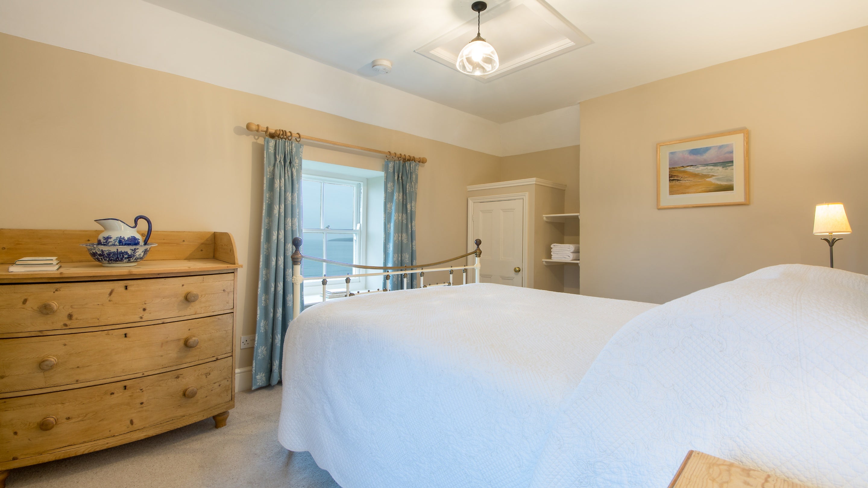 The double bedroom has sea views at Mowhay, Cornwall