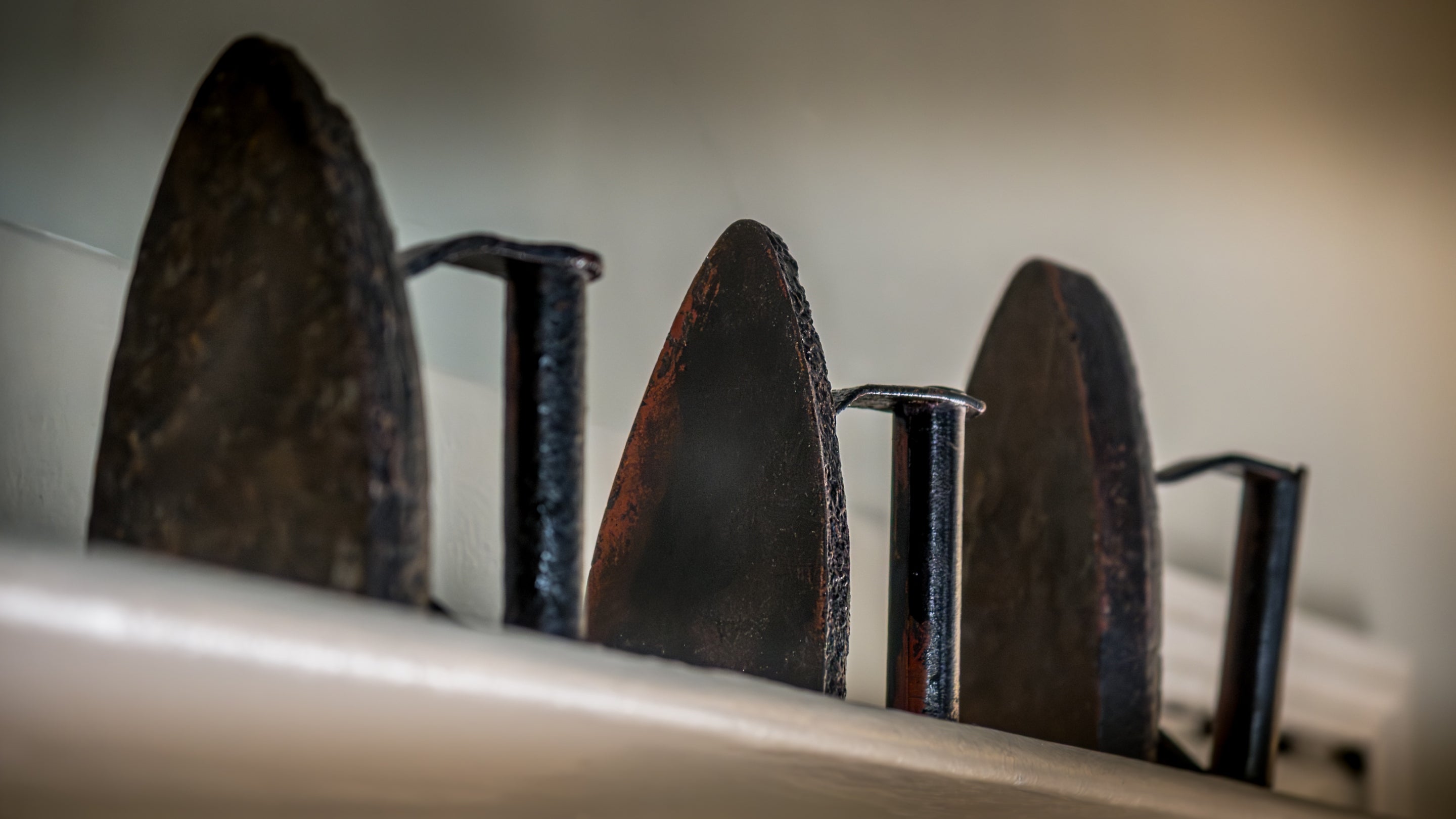 Antique flat irons in the sitting room at Nanceglos House, Cornwall