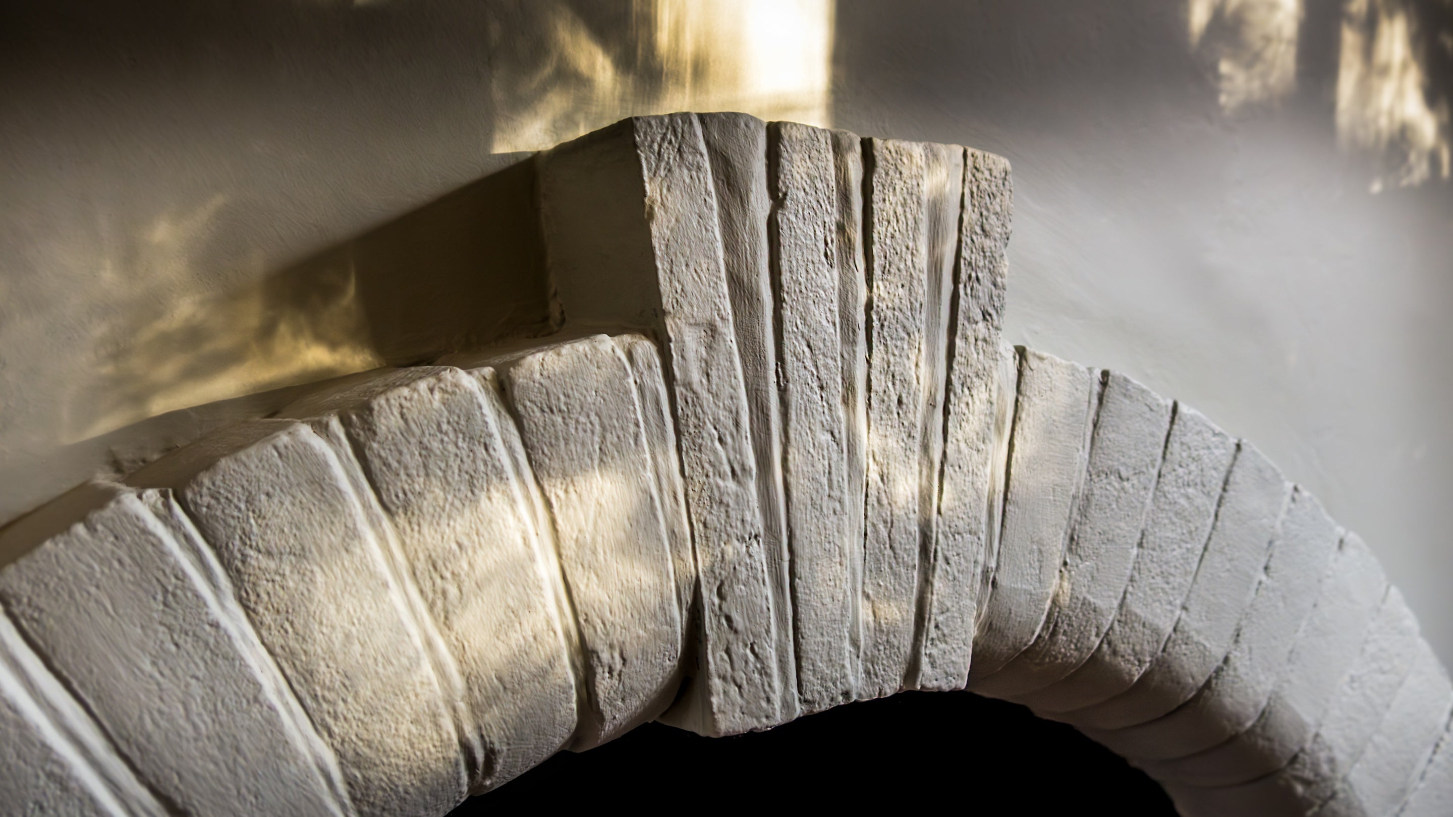 Details of the ornamental fireplace in the dining room at Nanceglos House, Cornwall