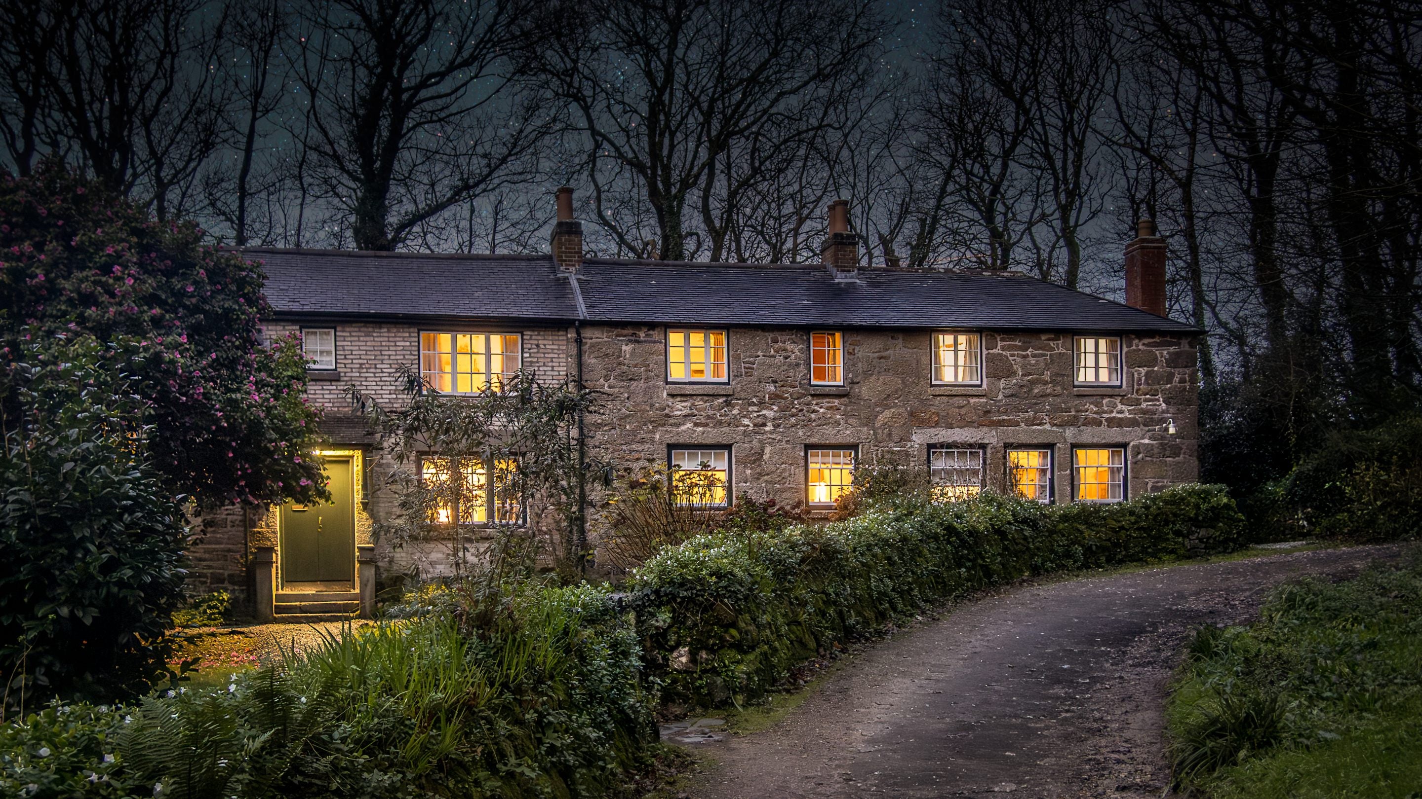 The exterior of Nanceglos House at dusk, Cornwall