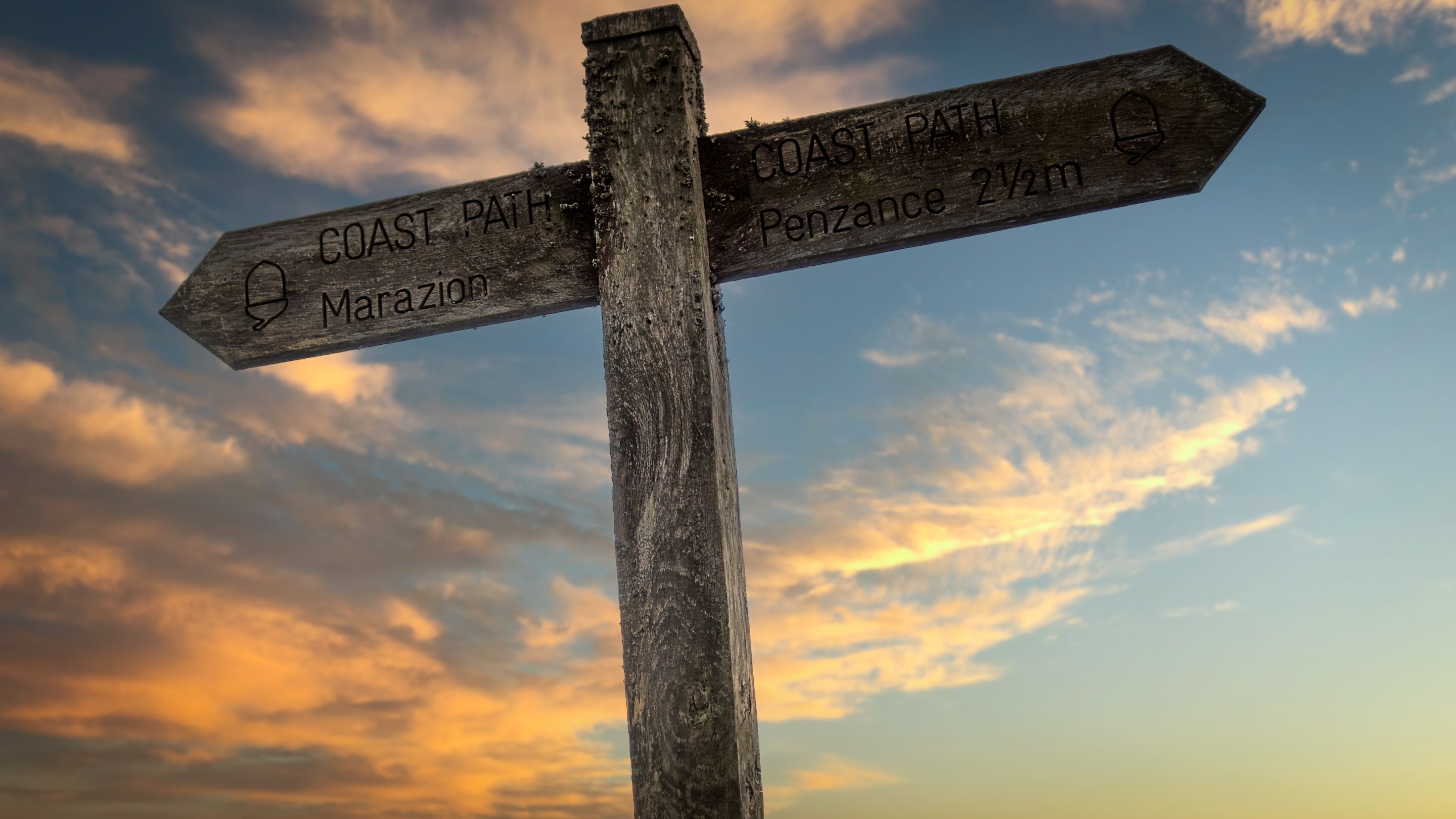Signs for the coast path near Nanceglos House, showing the way to Marazion beach and Penzance, Cornwall