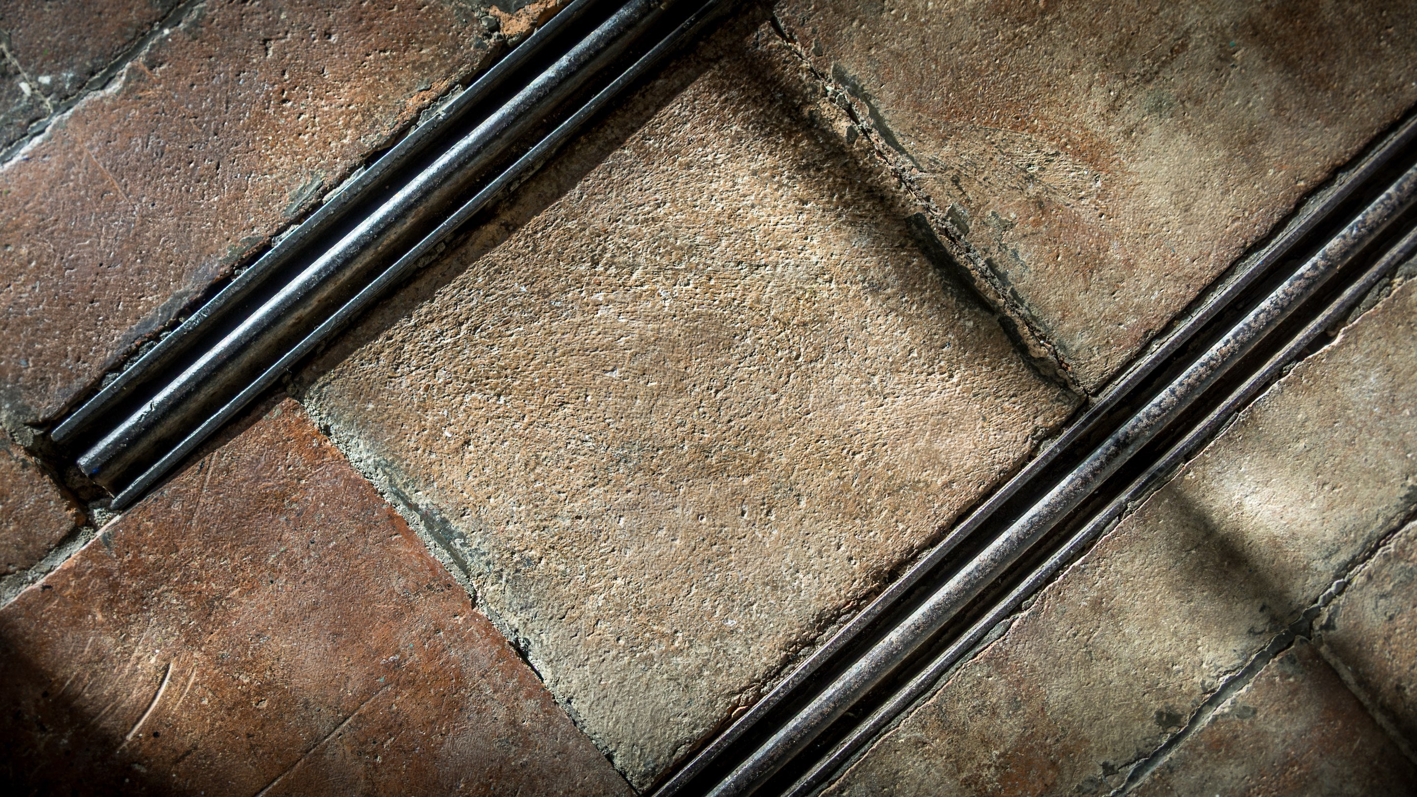 Industrial tracks set into the sitting room floor, originally used for a laundry cart at Nanceglos House, Cornwall