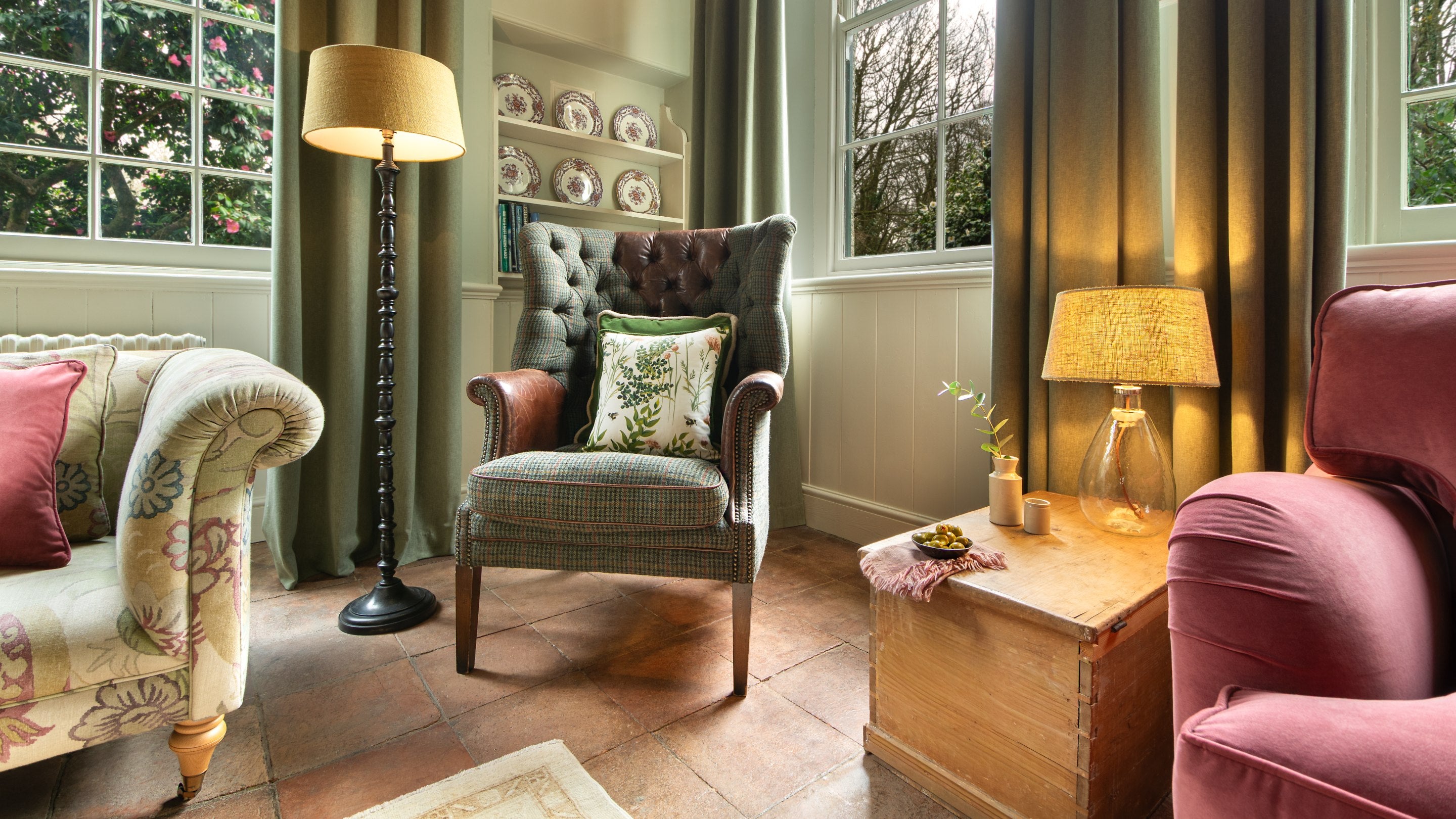 An armchair in the sitting room at Nanceglos House, Cornwall