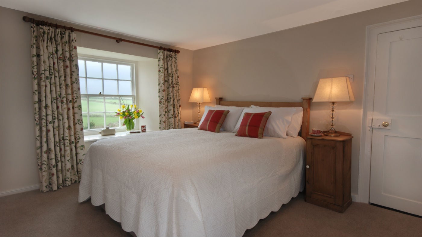 A double bedroom at The Old Farmhouse, Polzeath, Cornwall 