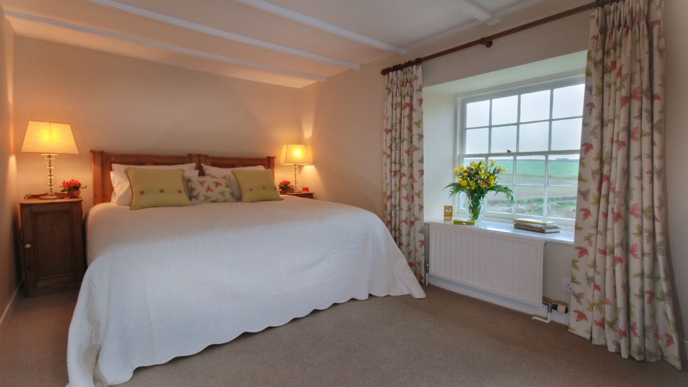 The master bedroom at The Old Farmhouse, Polzeath, Cornwall 