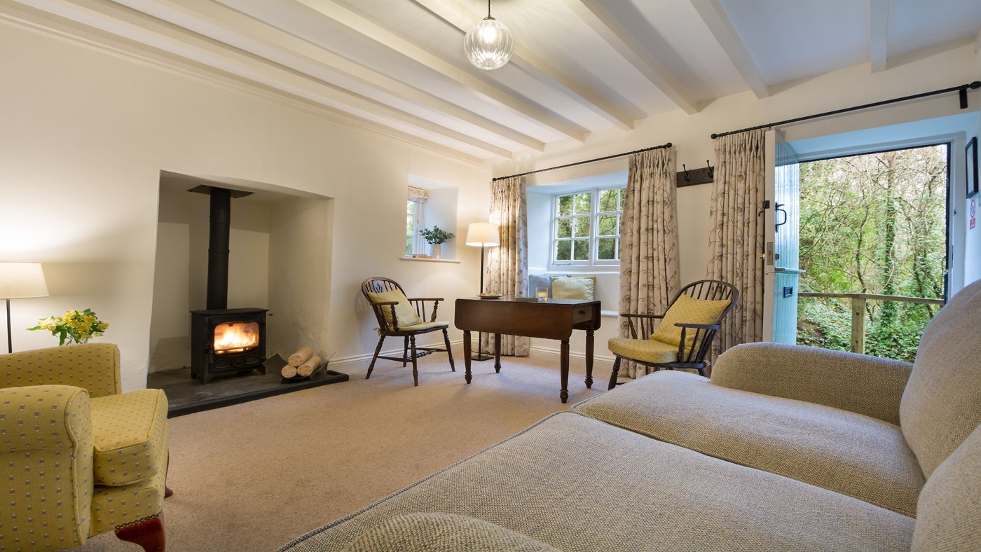 The sitting room and dining area at Penhaligon's, Roseland, Cornwall