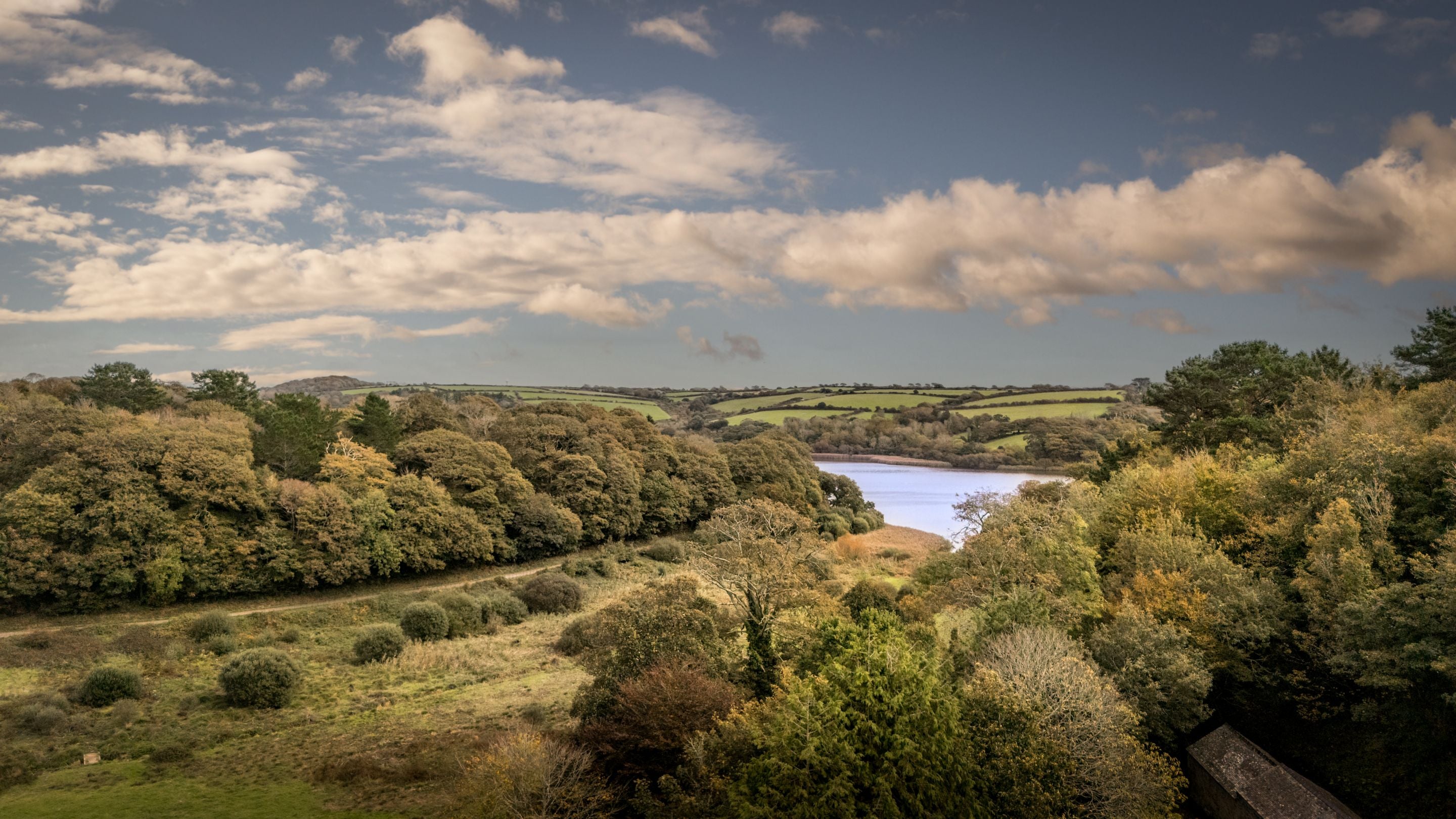 An aerial view of the Penrose countryside and Loe Pool, Cornwall