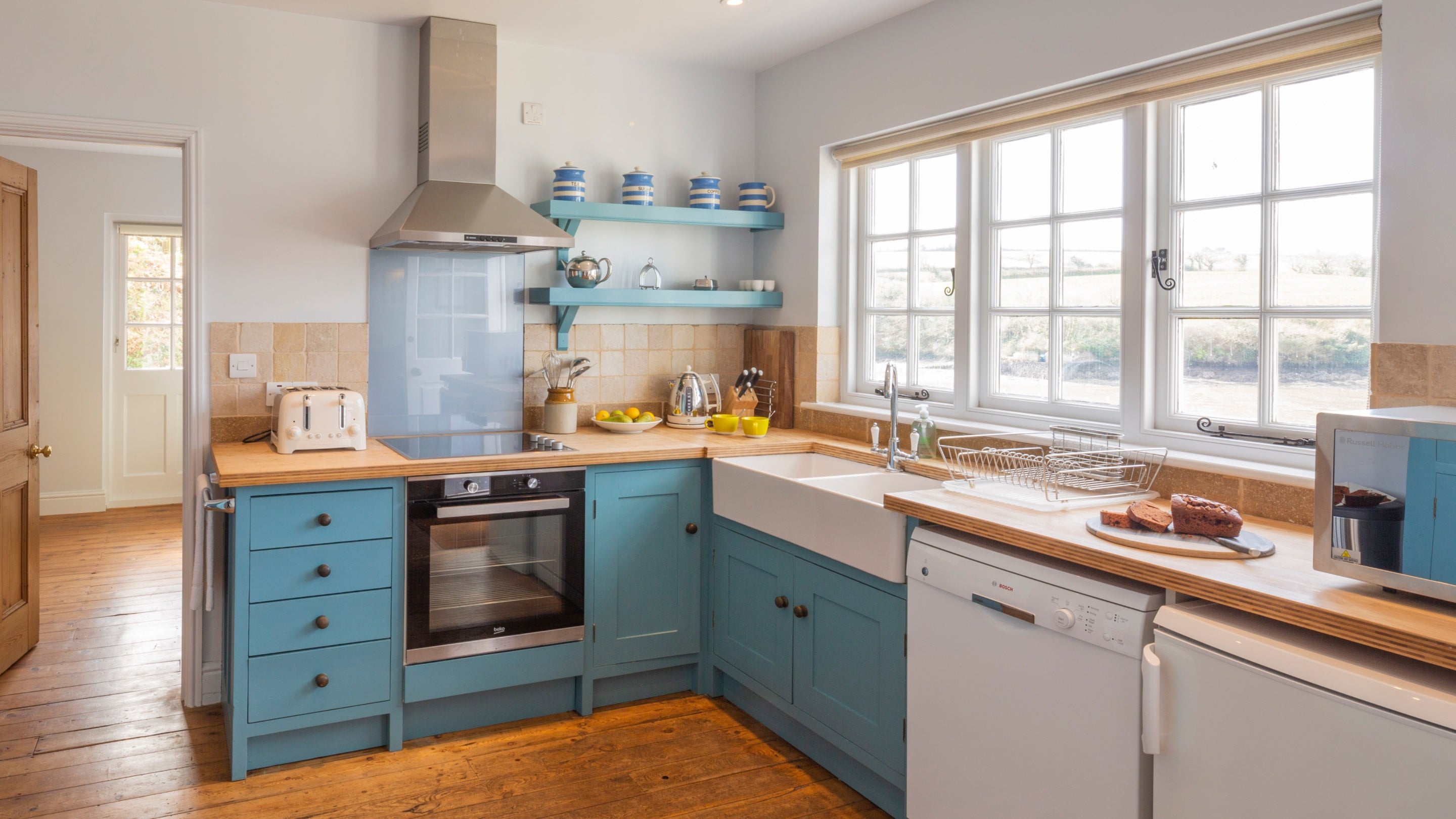 The kitchen has views across the water at Powders, Cornwall