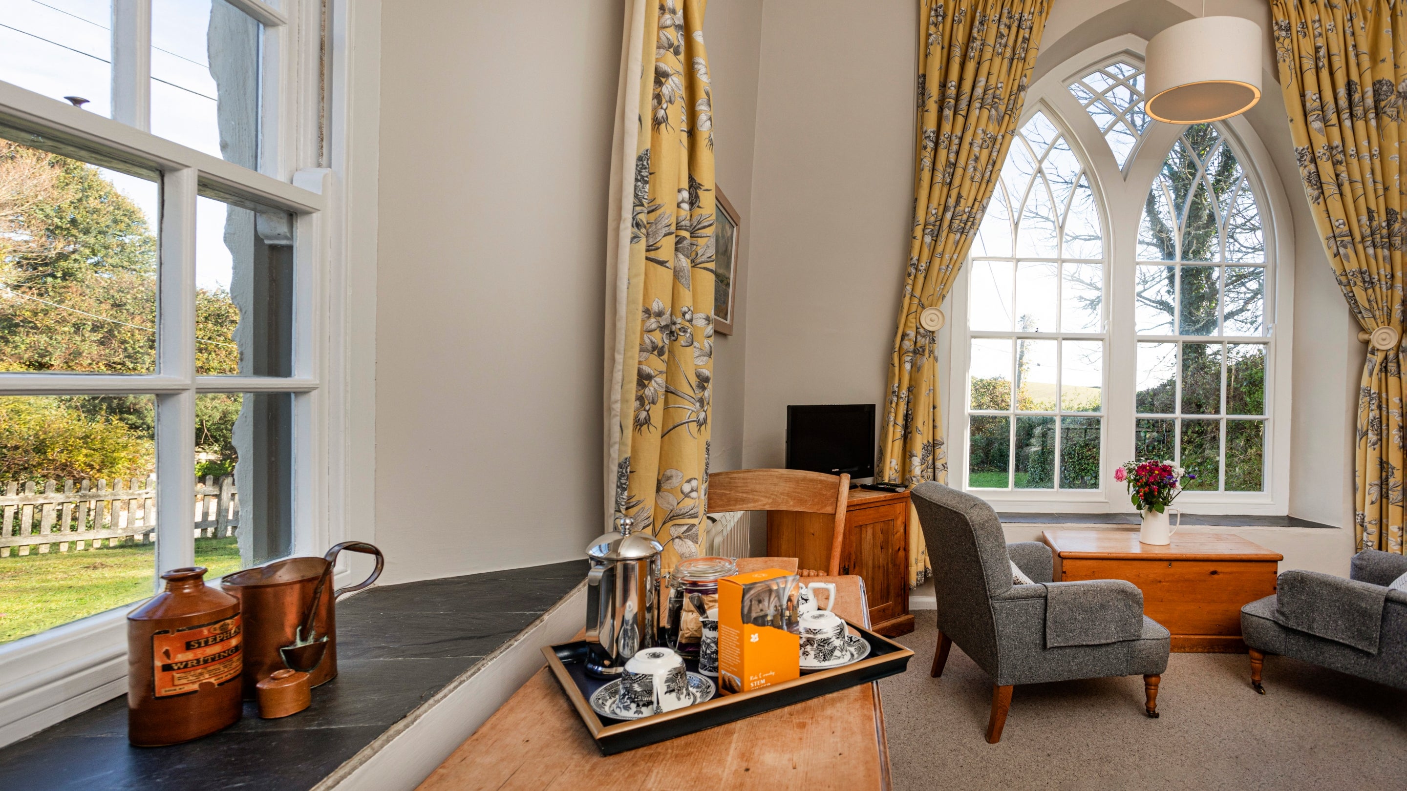 The living area and bedroom at Roseland Old School House, Cornwall