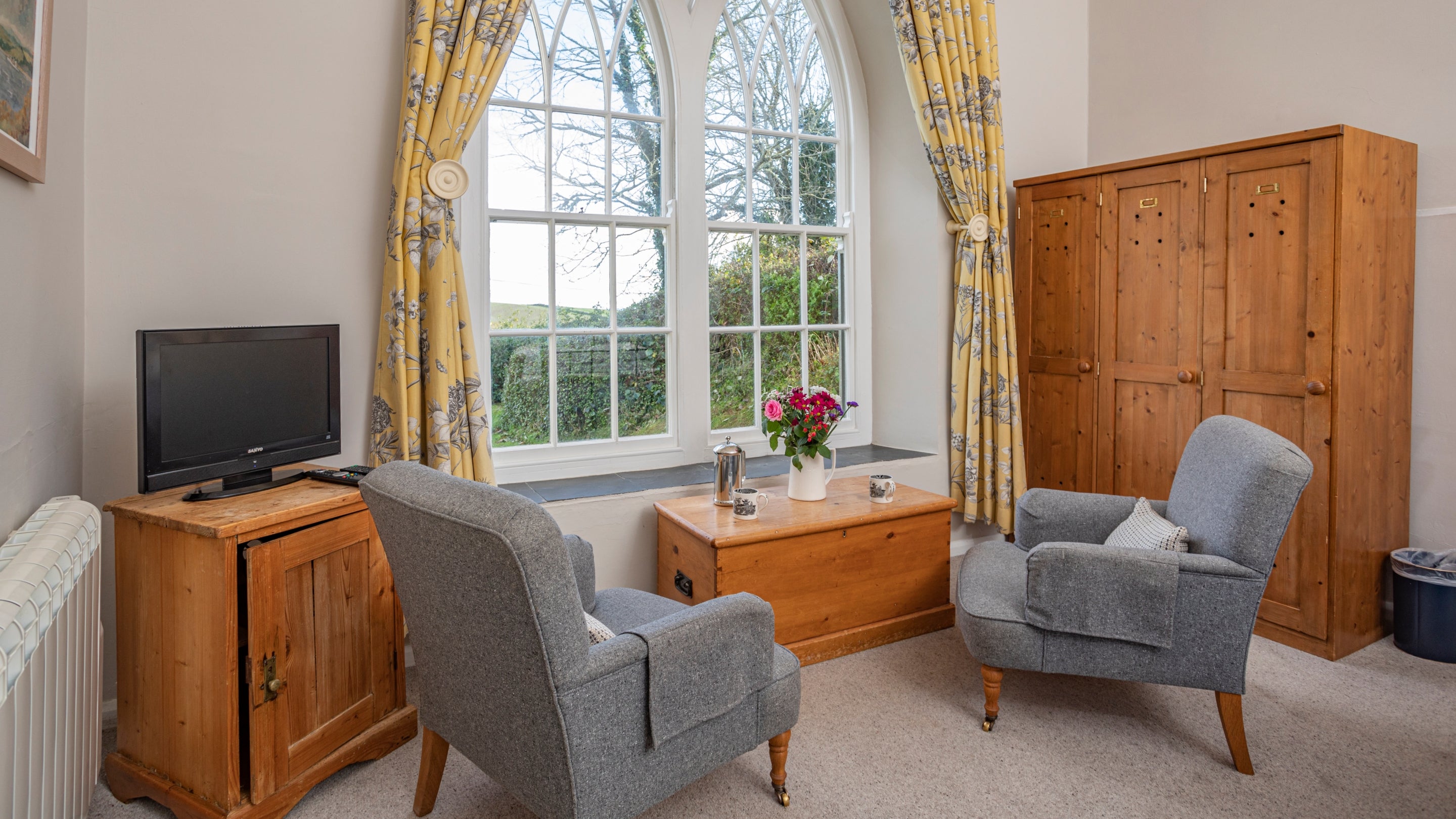 The living area and bedroom at Roseland Old School House, Cornwall