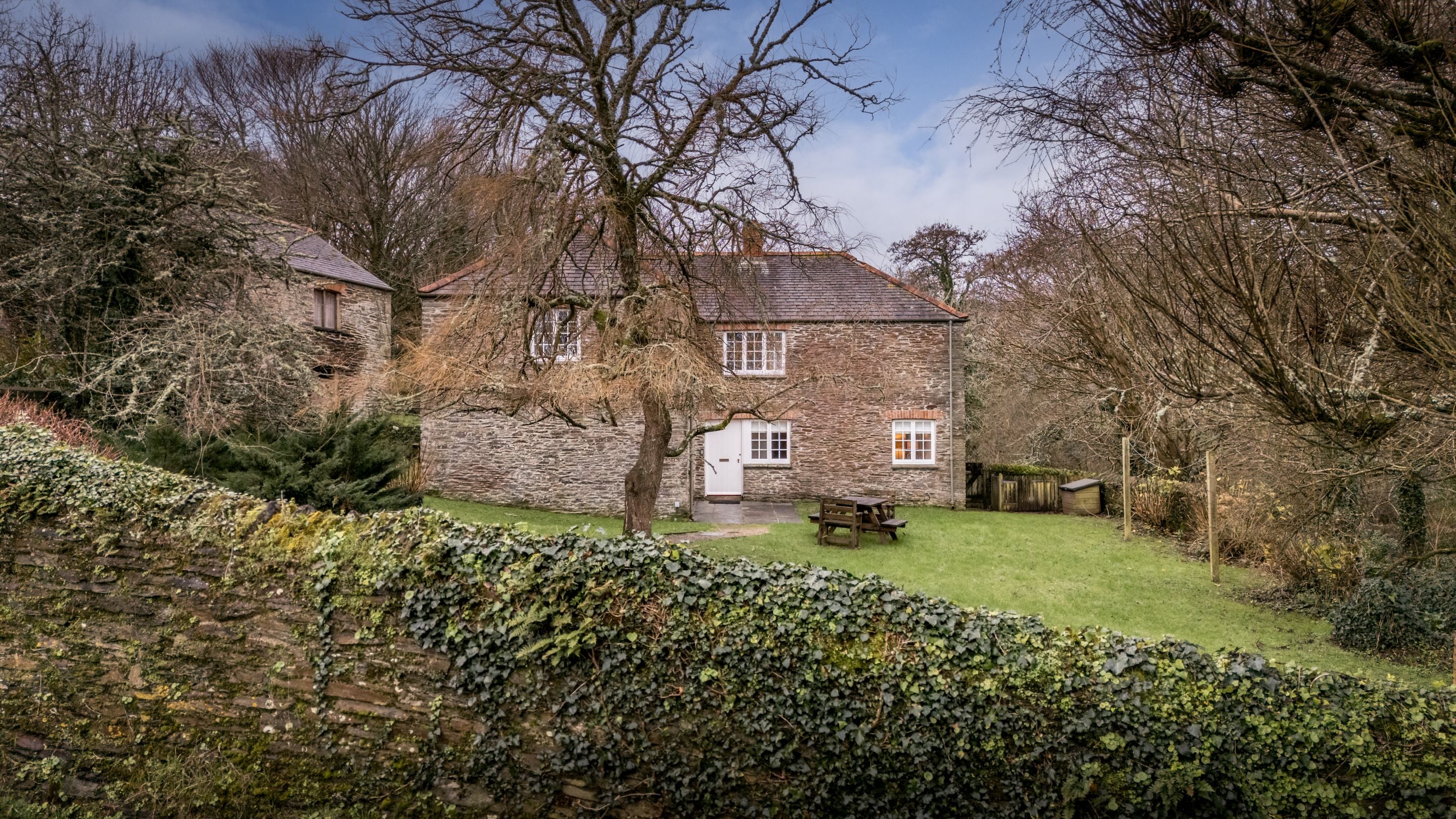 Roseland Porth Barn and its lawned garden, Cornwall