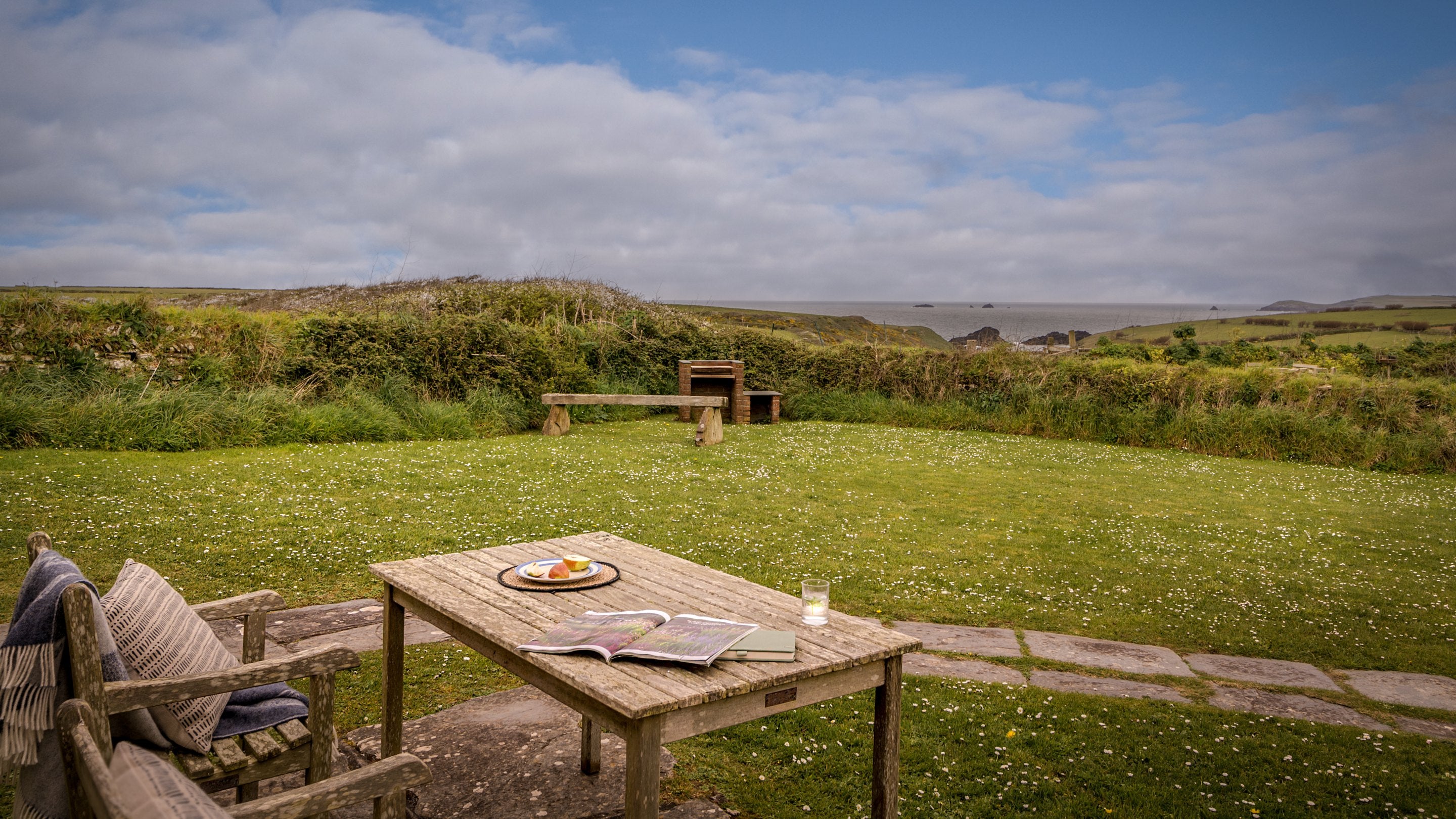 The sea view from the table and chairs in the garden at Skipper's Cabin, Cornwall