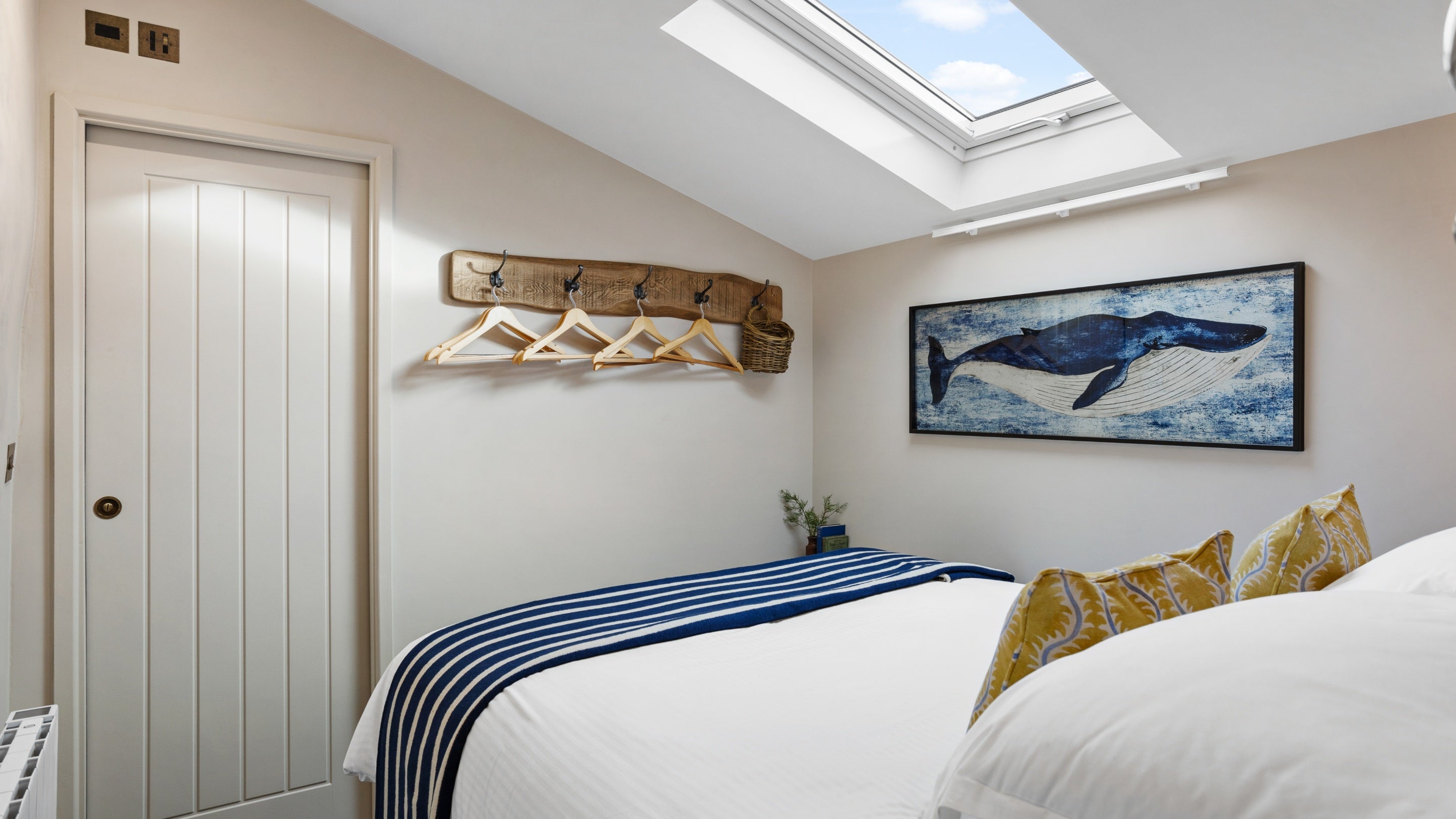 The small double bedroom with skylight and door leading to the en-suite shower room at Tom Parsons' Hut, Cornwall