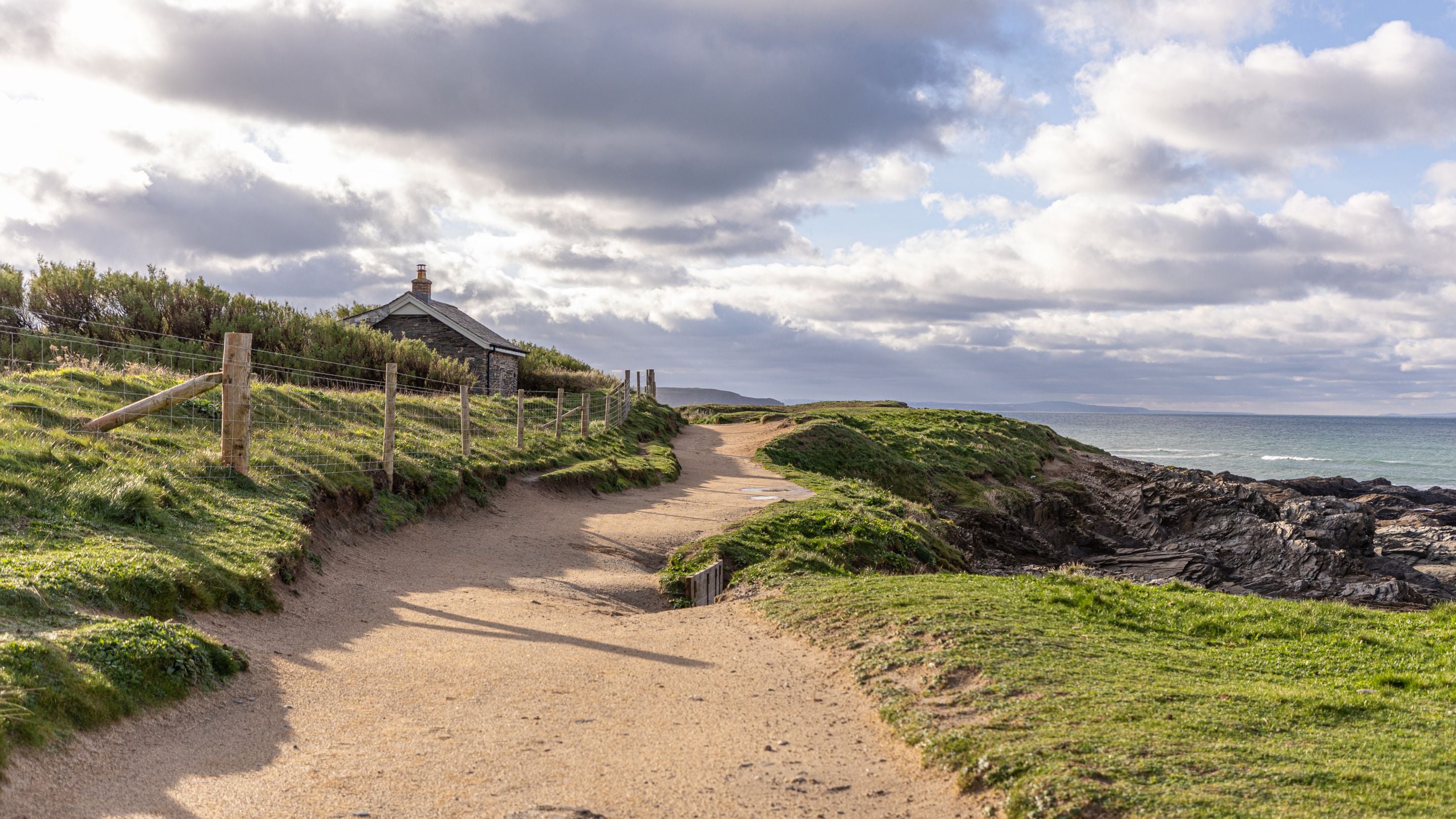 The coastal path, which runs past Tom Parsons' Hut towards the beach at Constantine Bay, Cornwall