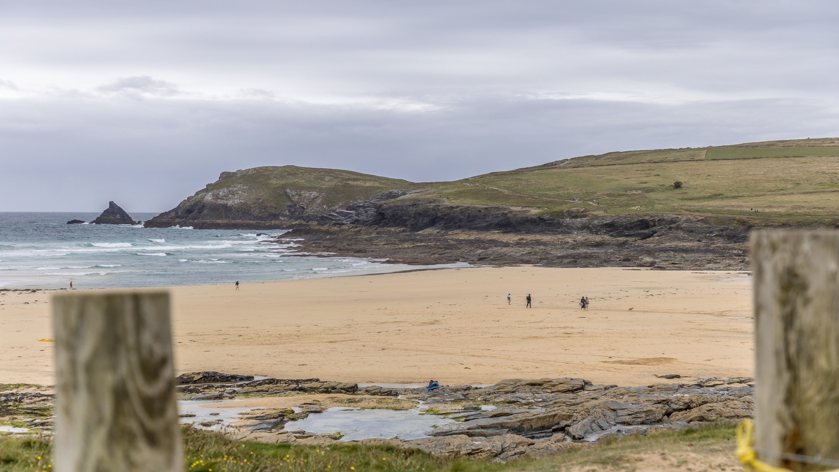 The sandy Booby's Bay beach, with rockpools during low tide and Trevose Head in the background, near Tom Parsons' Hut, Cornwall