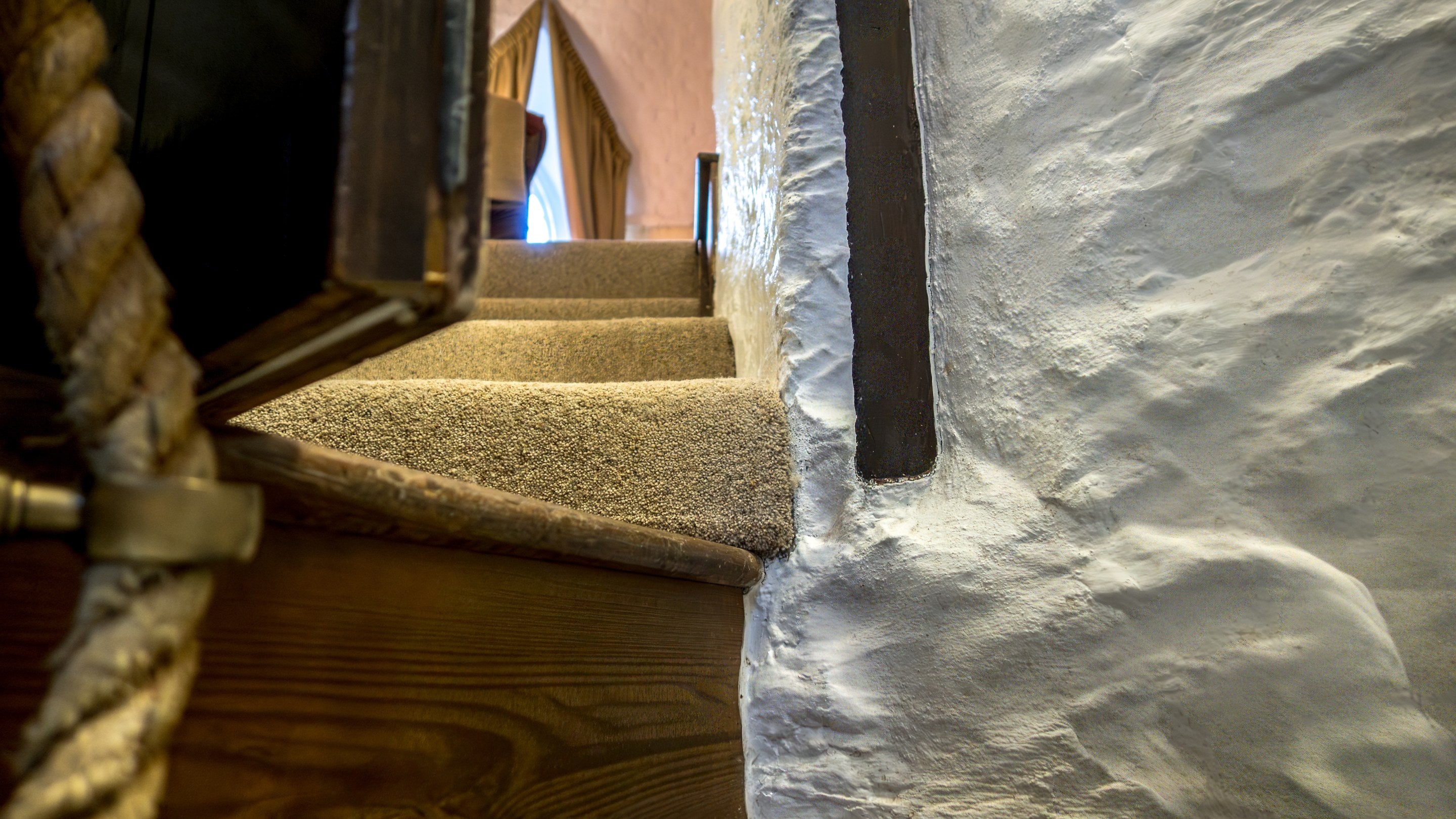 The stairs up to the sitting room from the staircase at Trelissick Water Tower, Cornwall