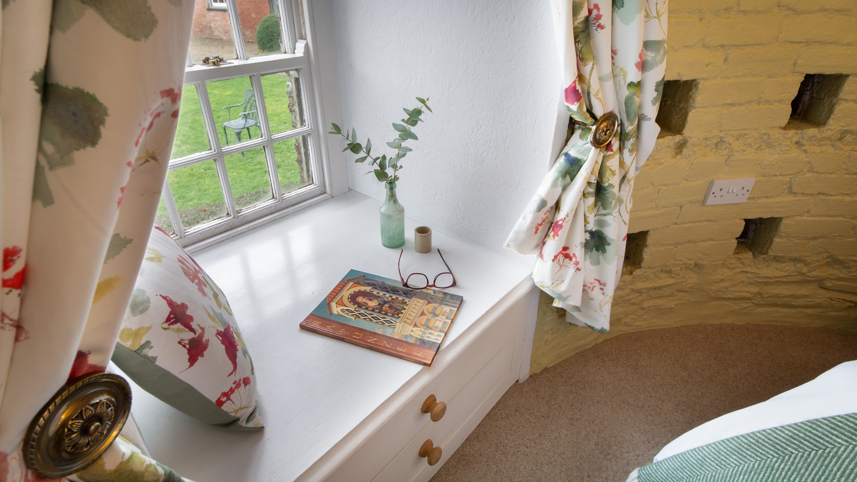 One of the windows in the bedroom at Trelissick Water Tower, with a deep sill with drawers underneath, Cornwall