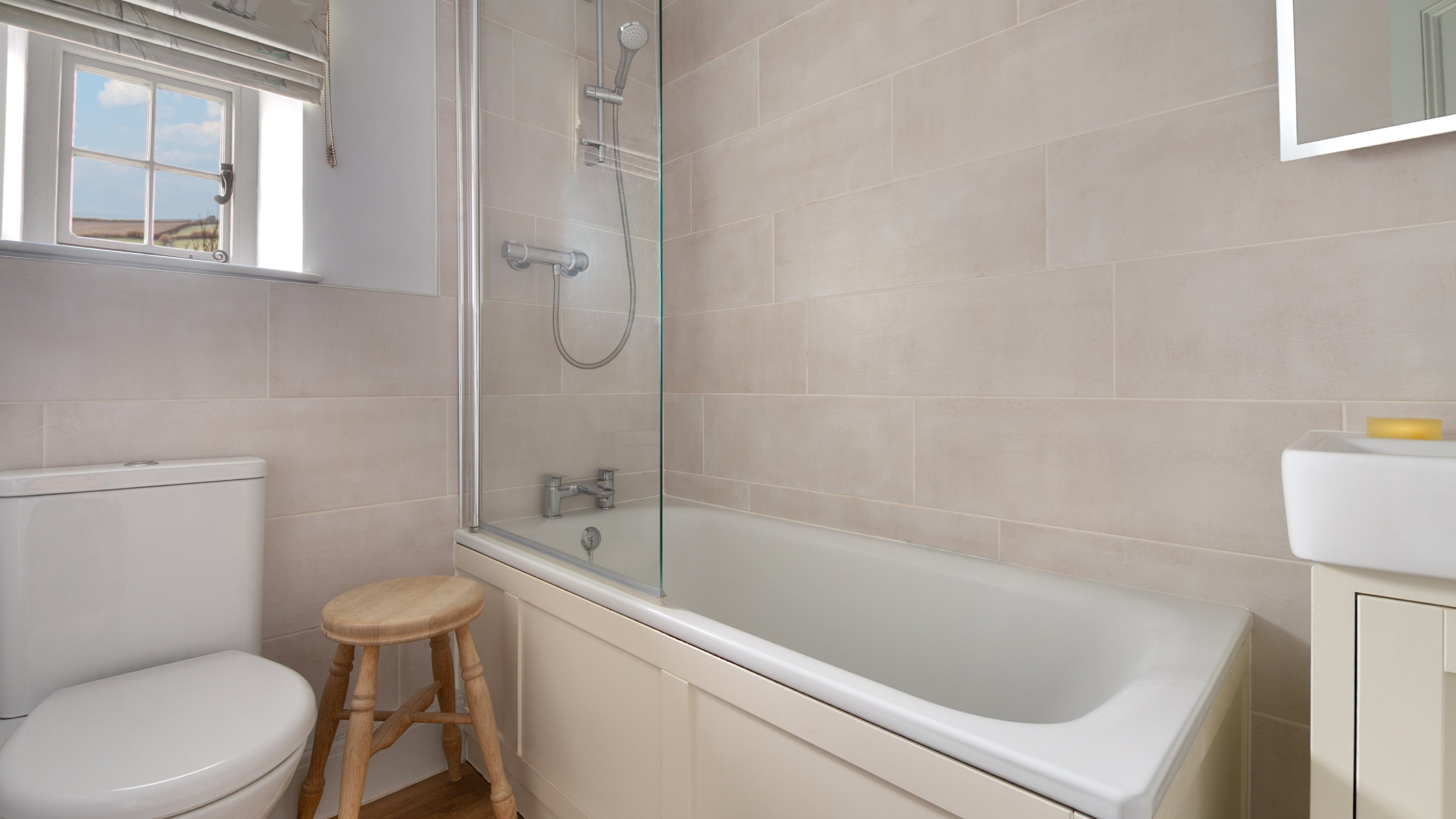 The bathroom at Trescore with shower over bath, Cornwall