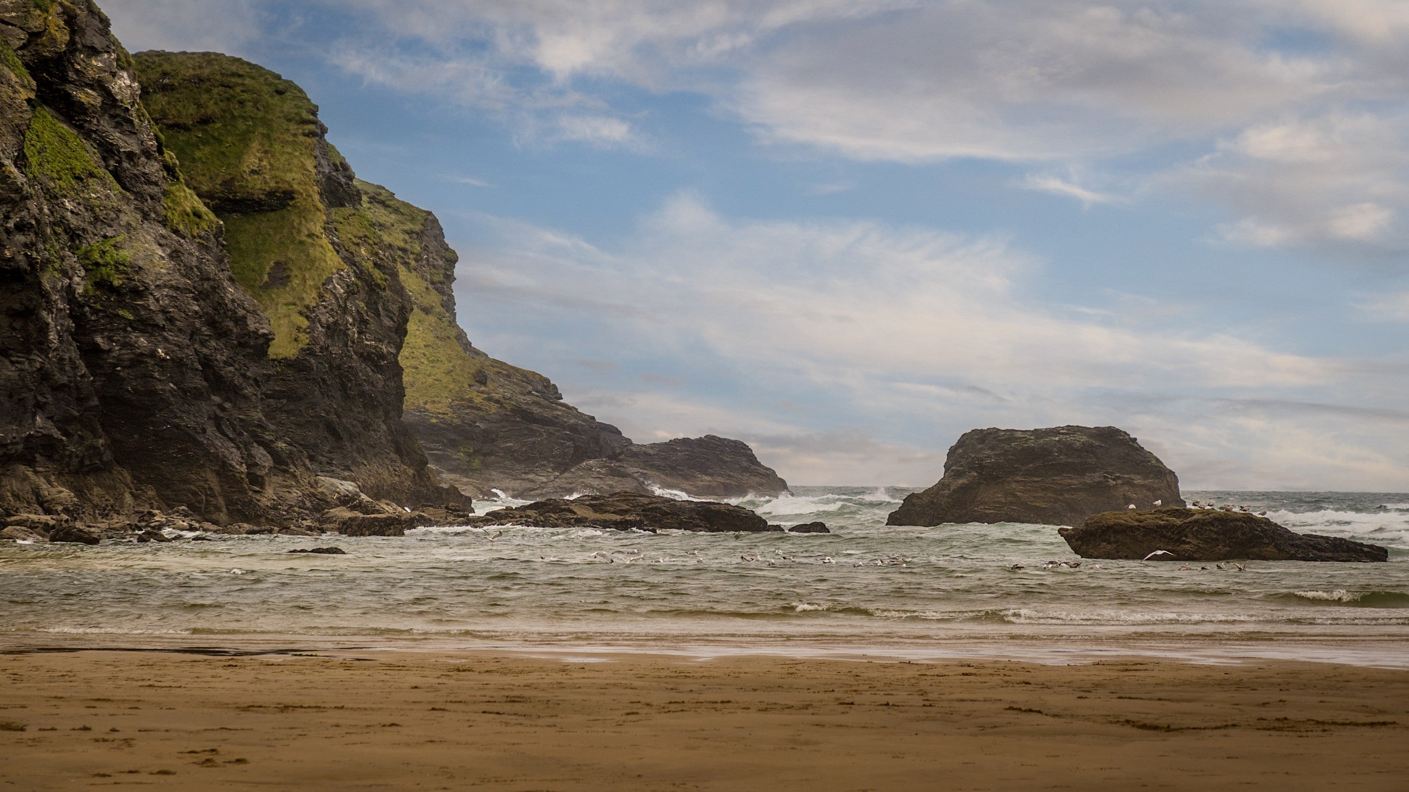 The sand and cliffs at Porthcothan Beach, Cornwall