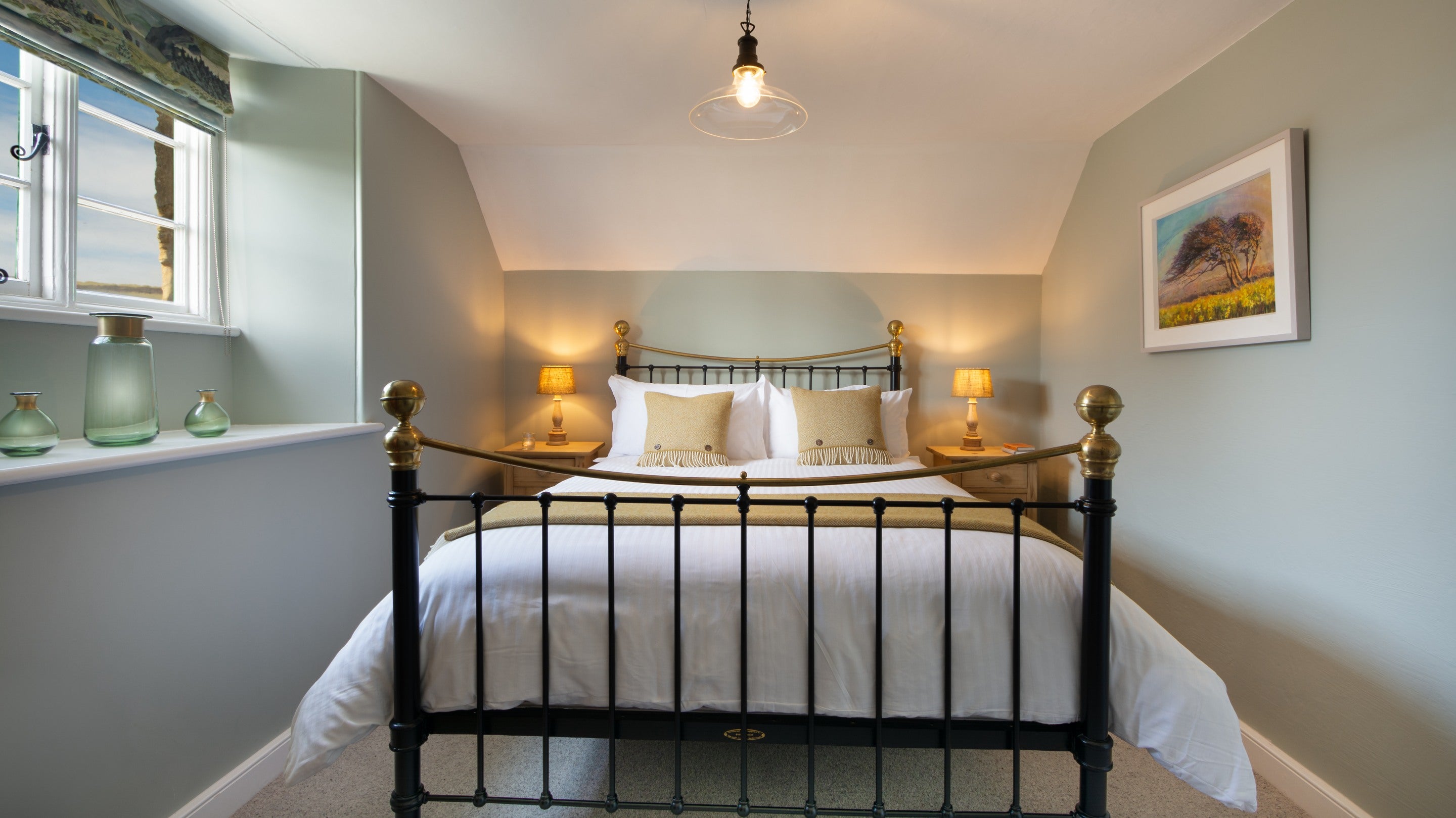 The king-size bedroom at Winnianton Farmhouse, Cornwall