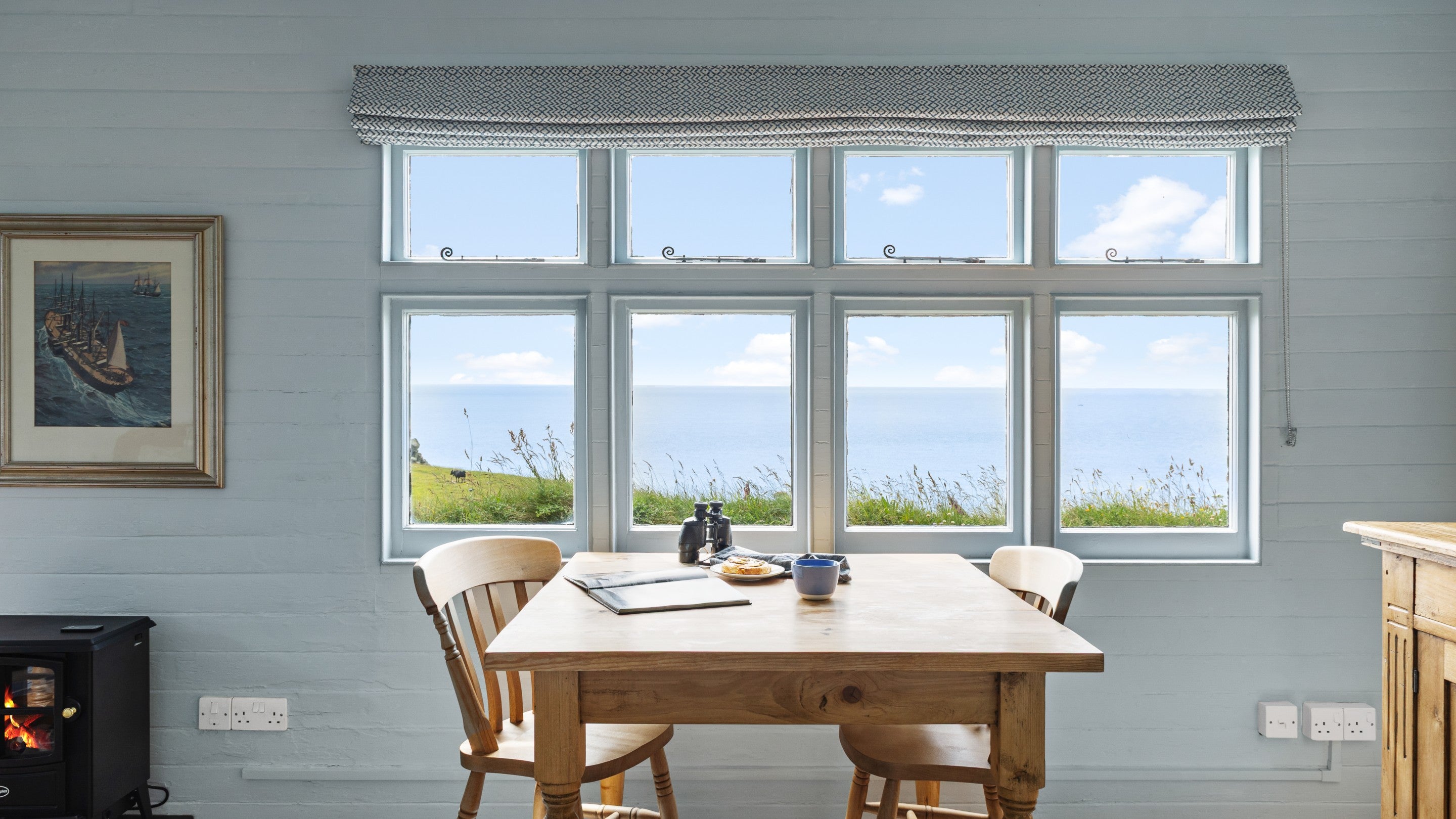 The dining table with sea view at Wireless Cottage, Cornwall