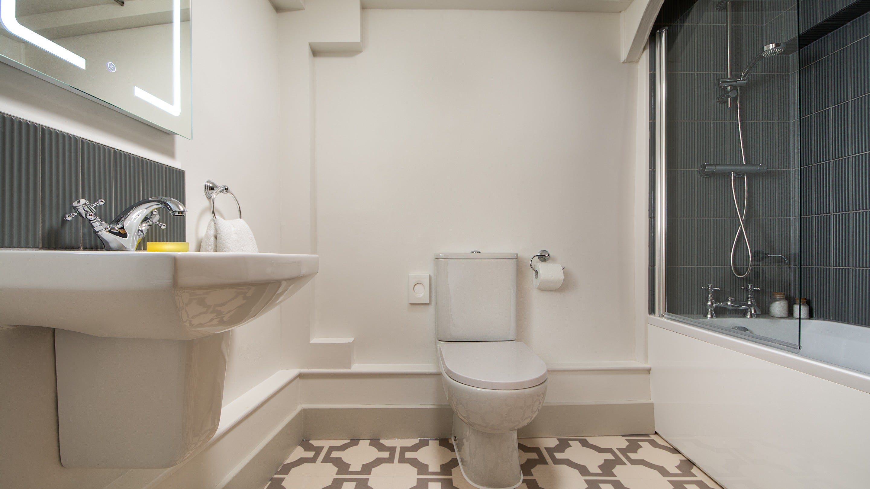 The bathroom, with shower over bath, at 1 Arlington Row, Gloucestershire