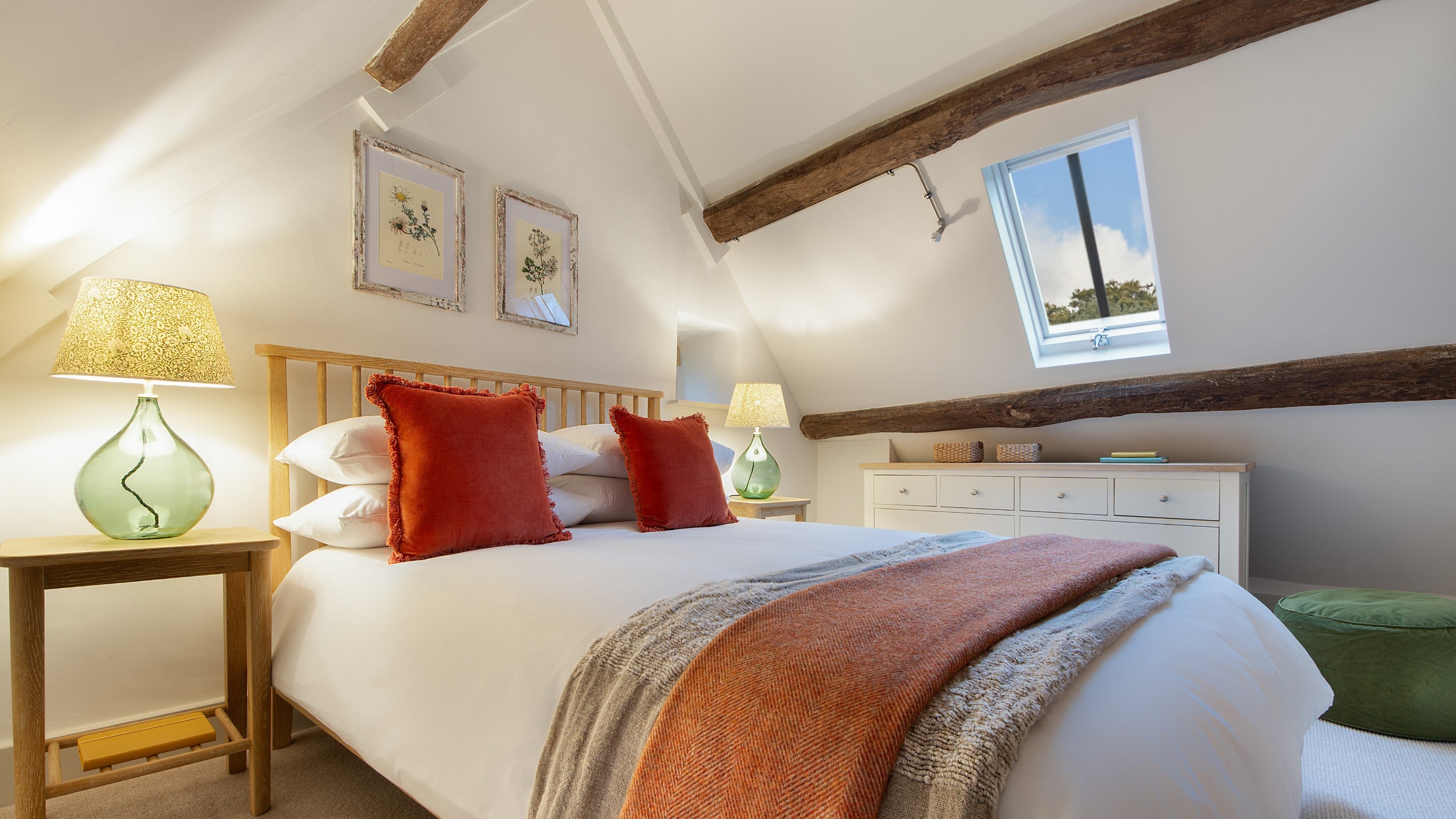 The double bedroom of 1 Arlington Row is in the eaves on the second floor, with sloping ceilings, Gloucestershire