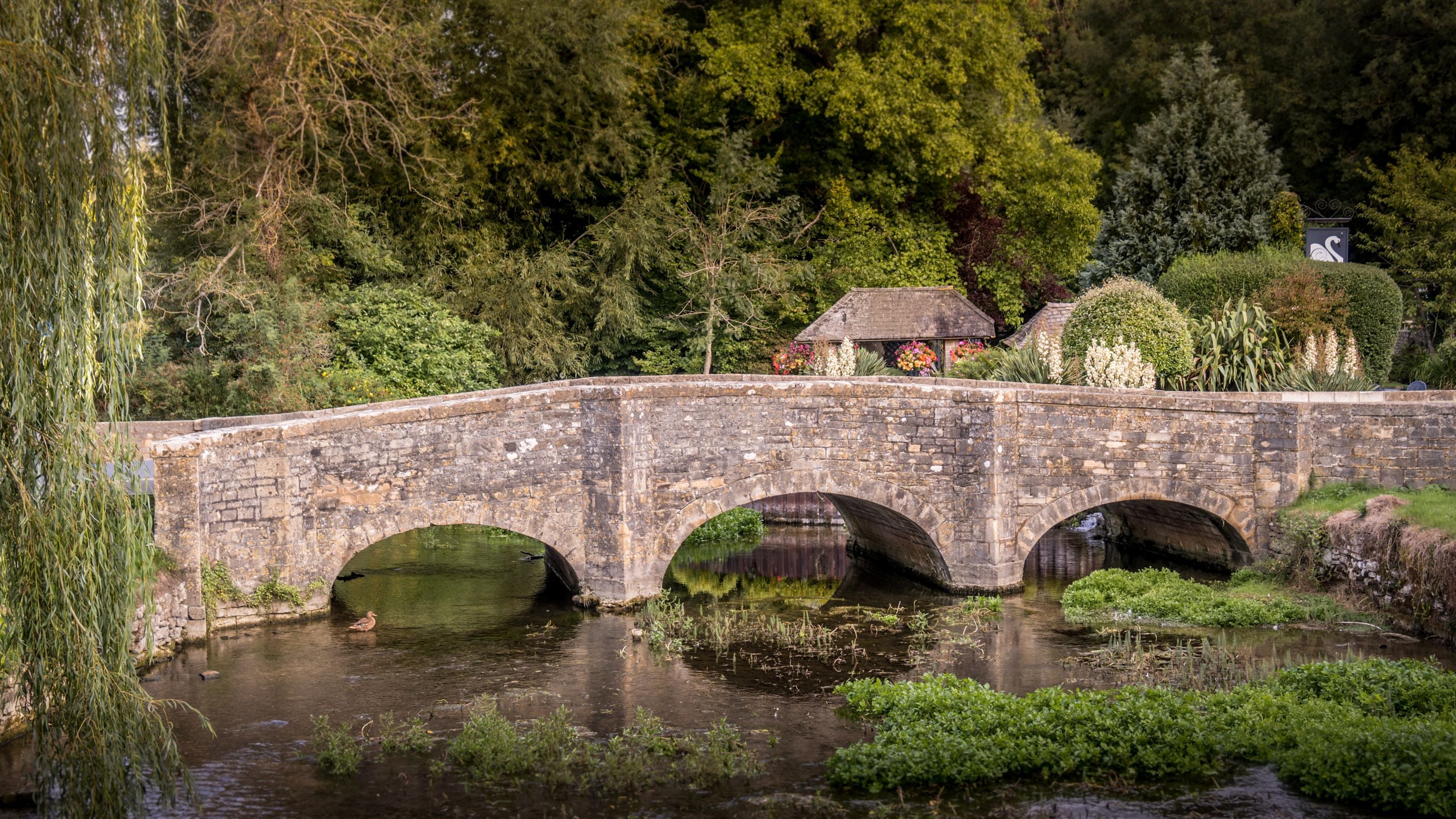 A bridge over the River Coln in Bibury, near 1 Arlington Row, Gloucestershire