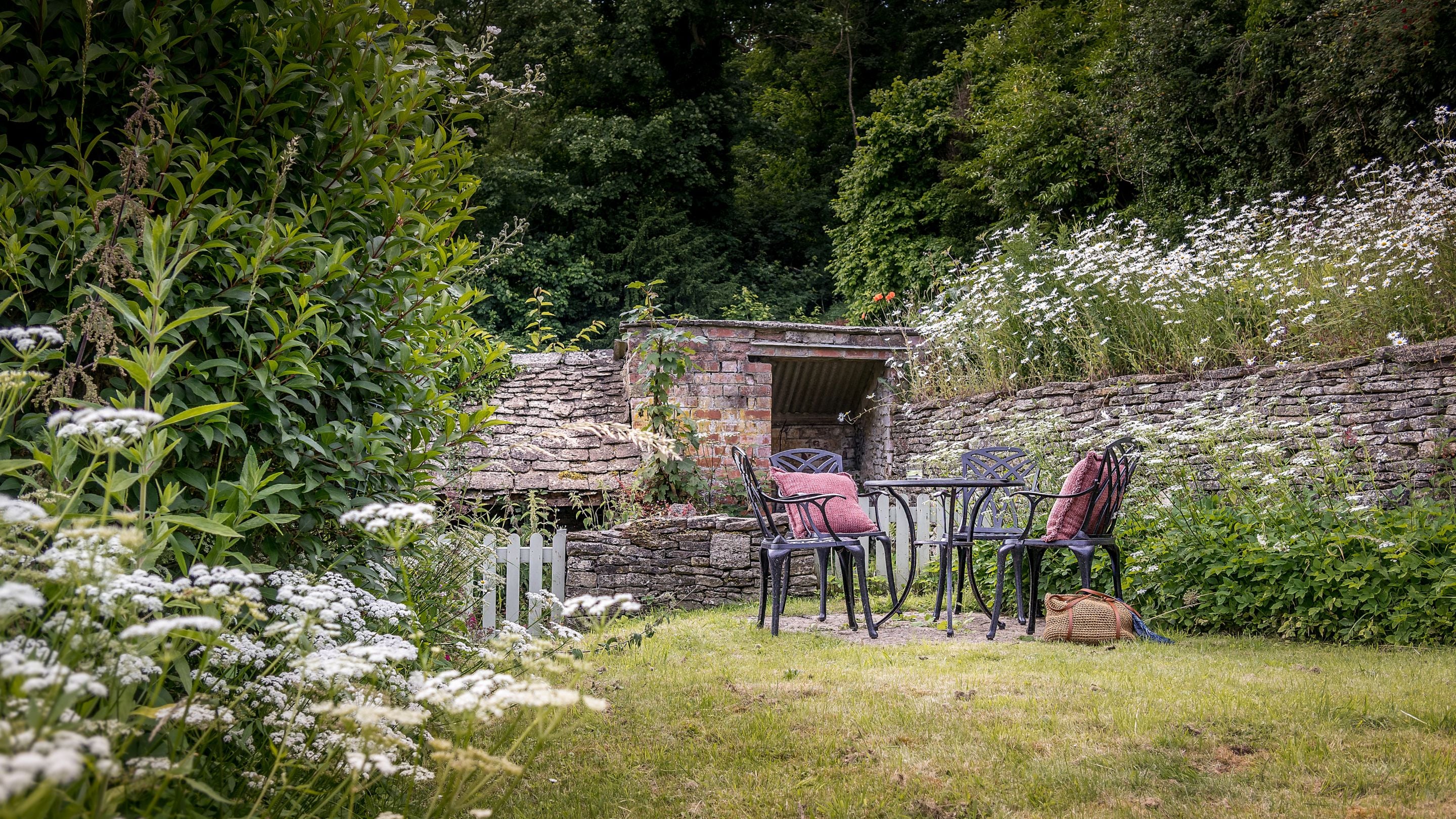 The outdoor table and chairs at the end of the rear garden at 9 Arlington Row, Gloucestershire