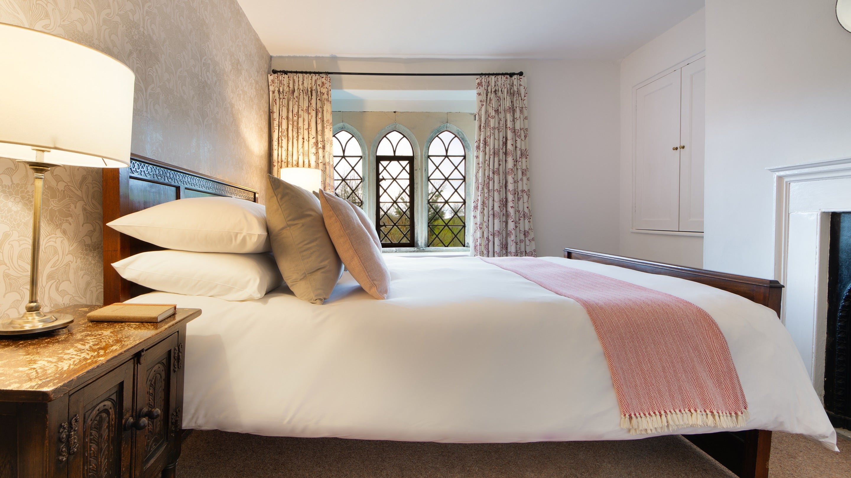 One of the king-size bedrooms at Newark Lower Lodge, Gloucestershire
