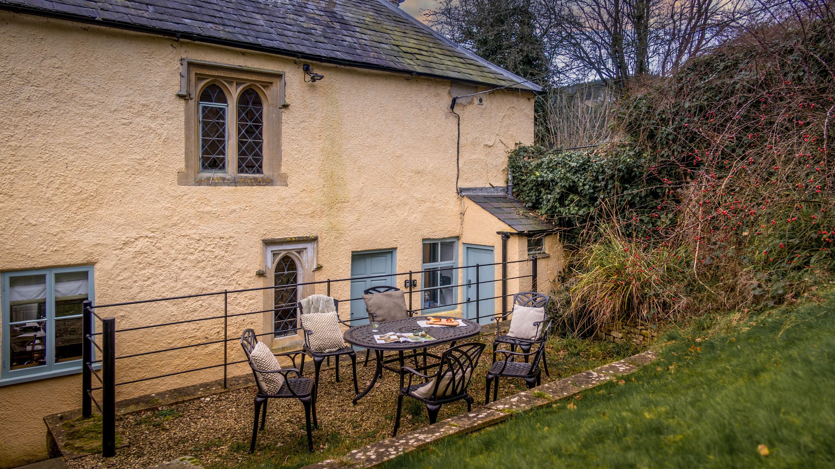 The table and chairs in the garden in winter at Newark Lower Lodge, Gloucestershire
