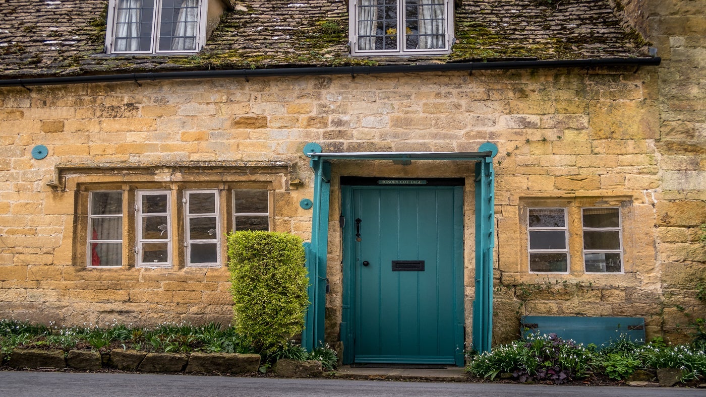The stone exterior of Honor's Cottage, Snowshill, nr Broadway, Gloucestershire