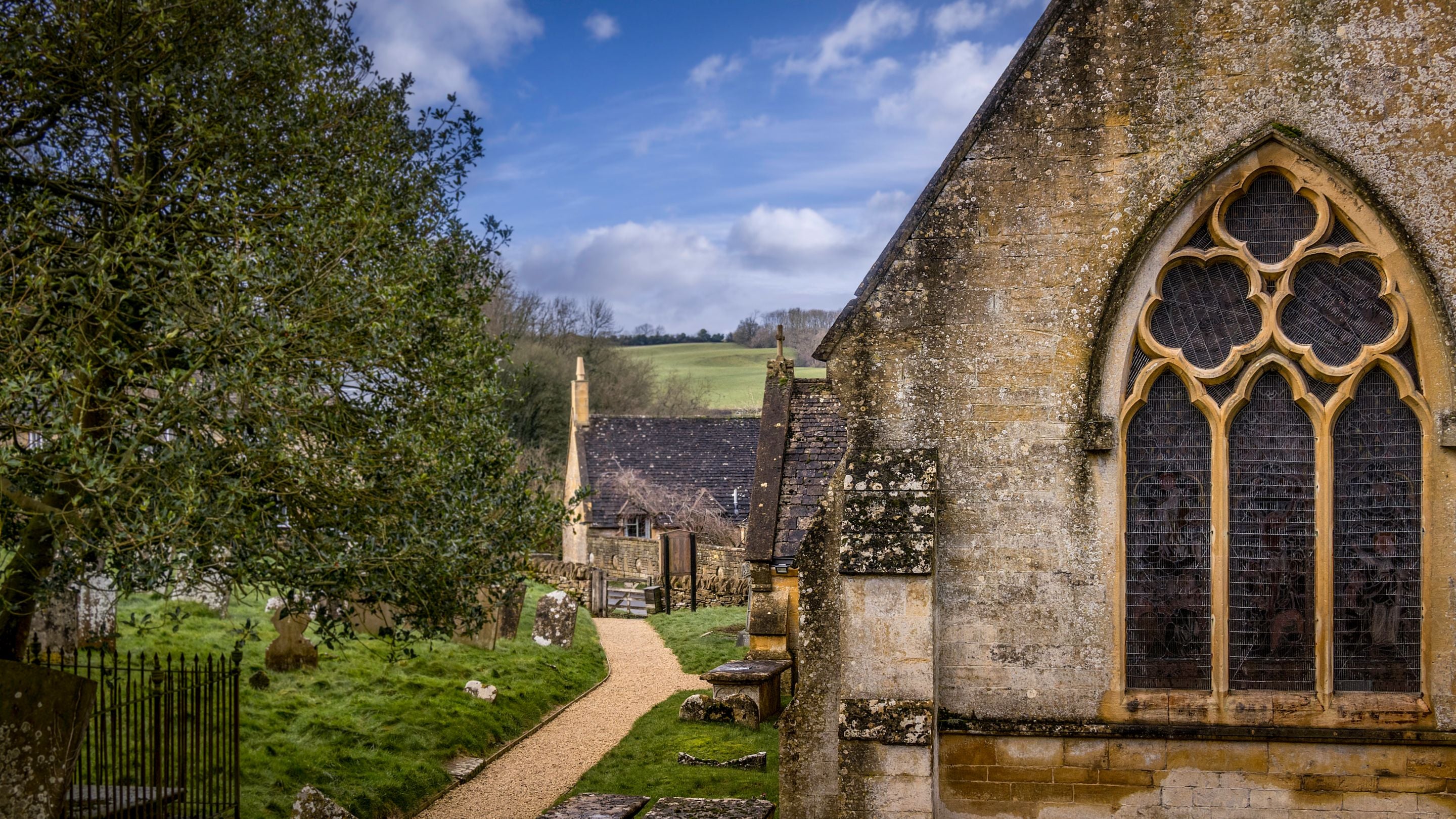 The church in the village surrounding Spring Cottage in winter, Gloucestershire