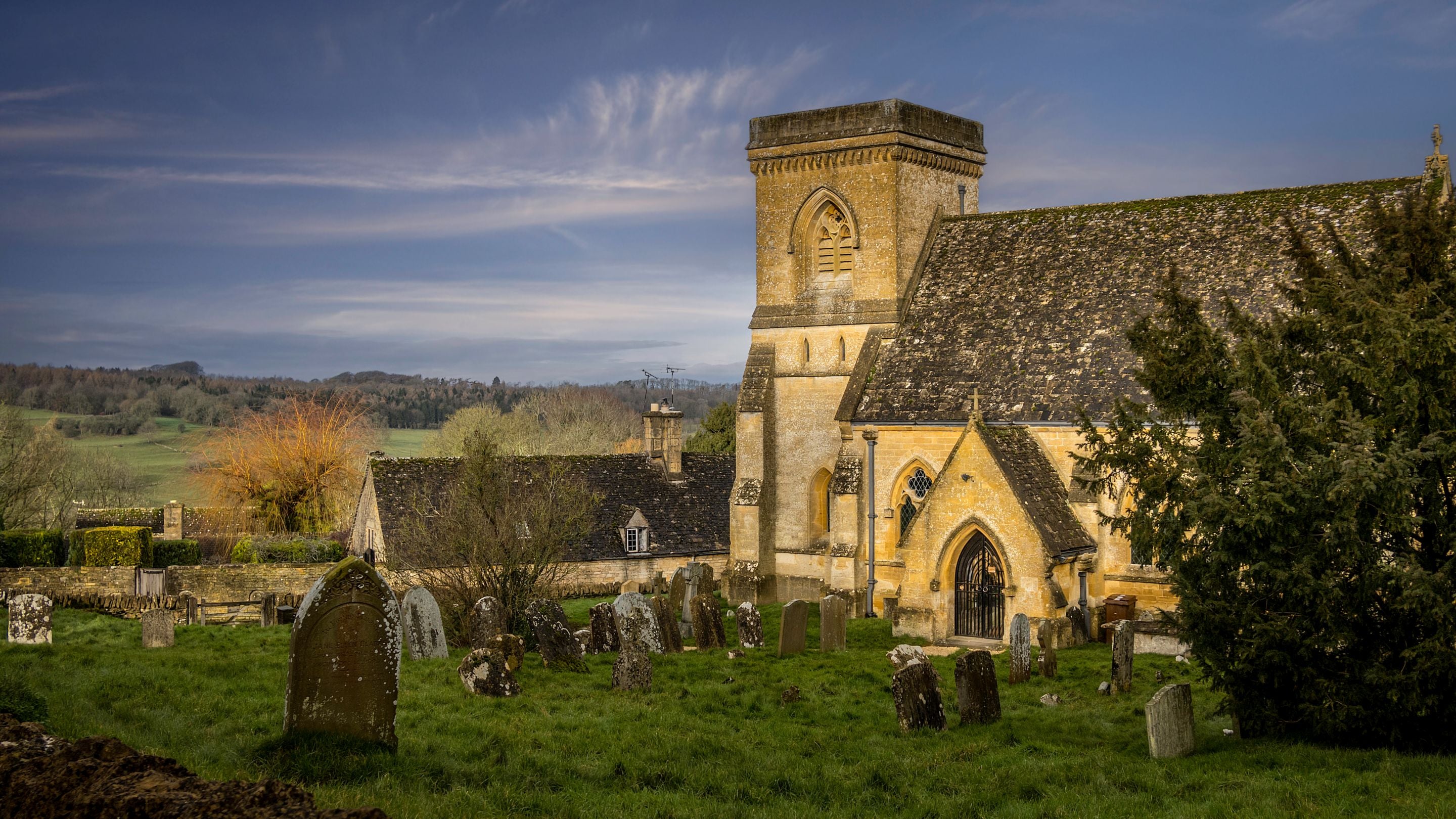 The church in the village surrounding Spring Cottage in winter, Gloucestershire