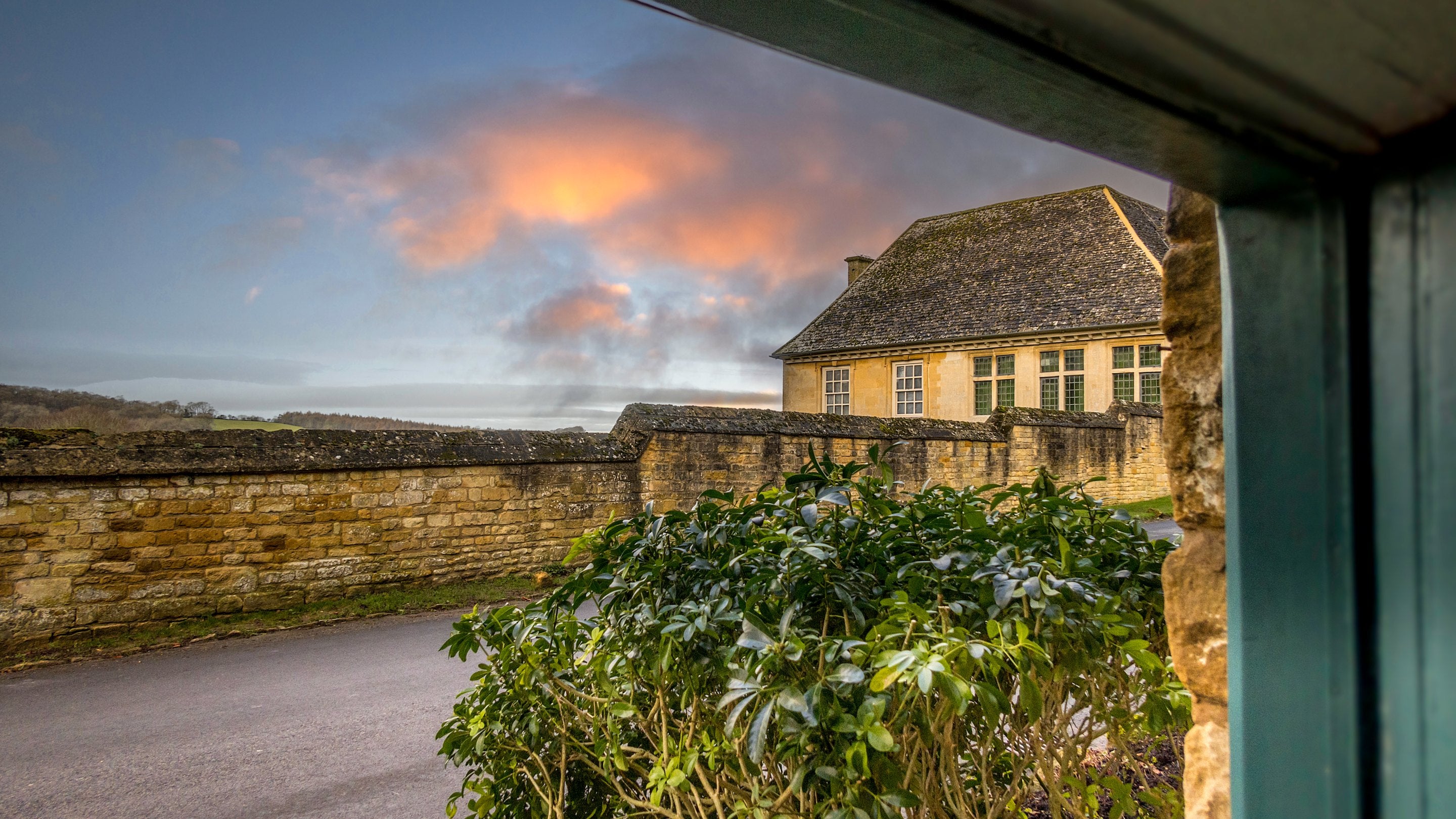 The view from Spring Cottage to Snowshill Manor and Garden in winter, Gloucestershire