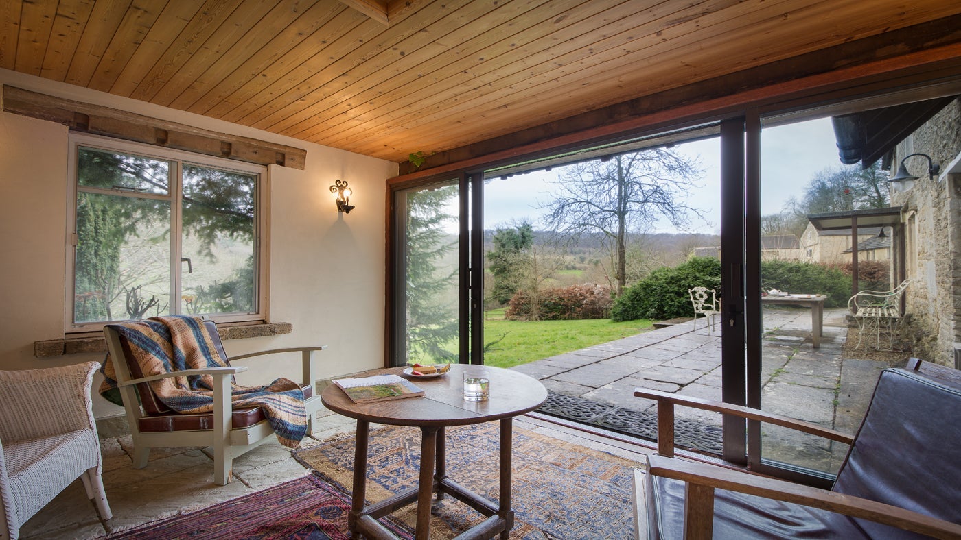 Sunroom and garden area at Woody's Cottage, Sheepscombe, Gloucestershire