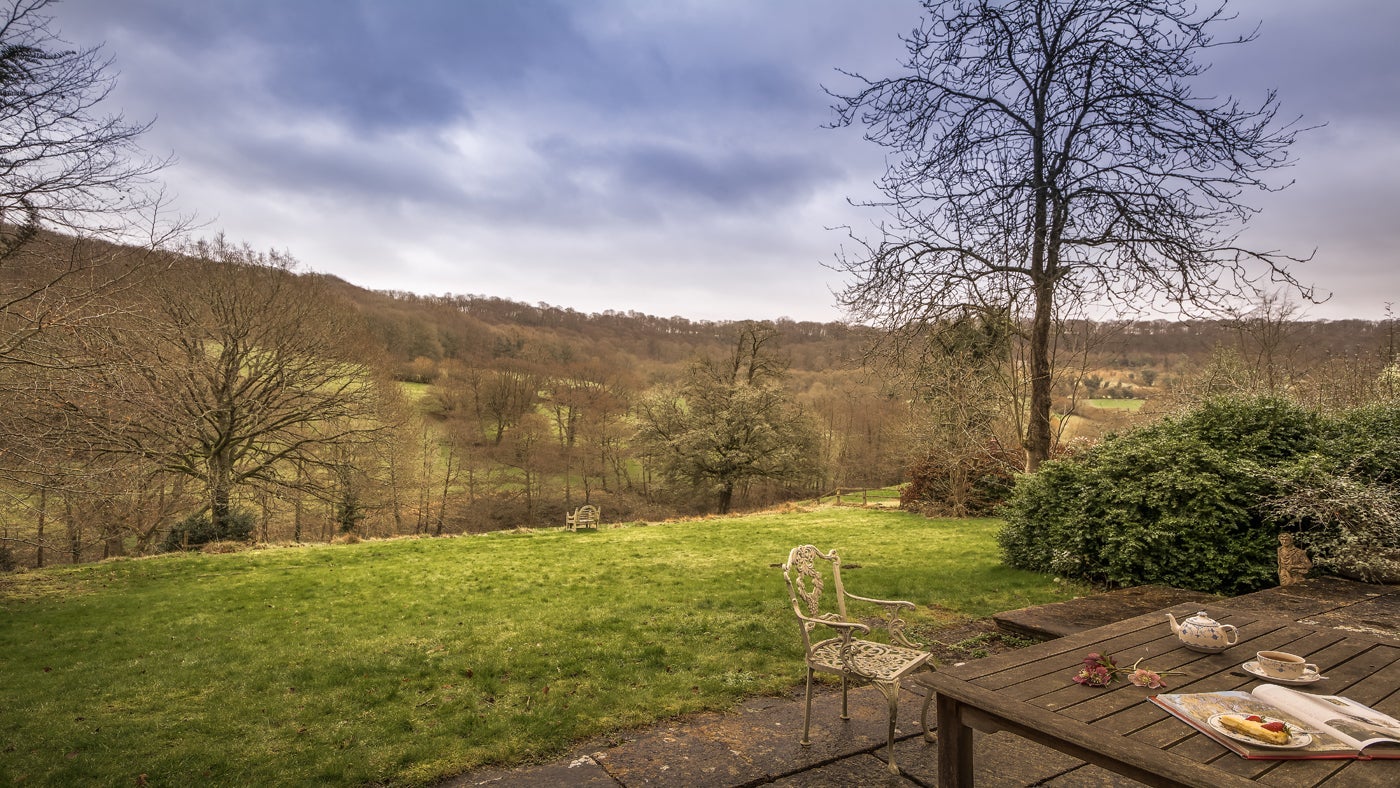 The garden and surrounding view at Woody's Cottage, Sheepscombe, Gloucestershire