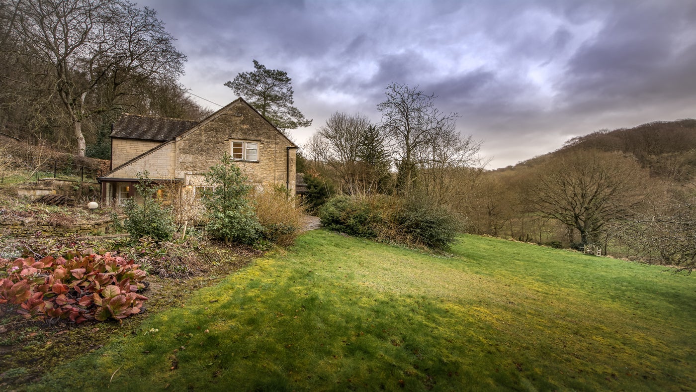Exterior stone frontage of Woody's Cottage, Sheepscombe, Gloucestershire