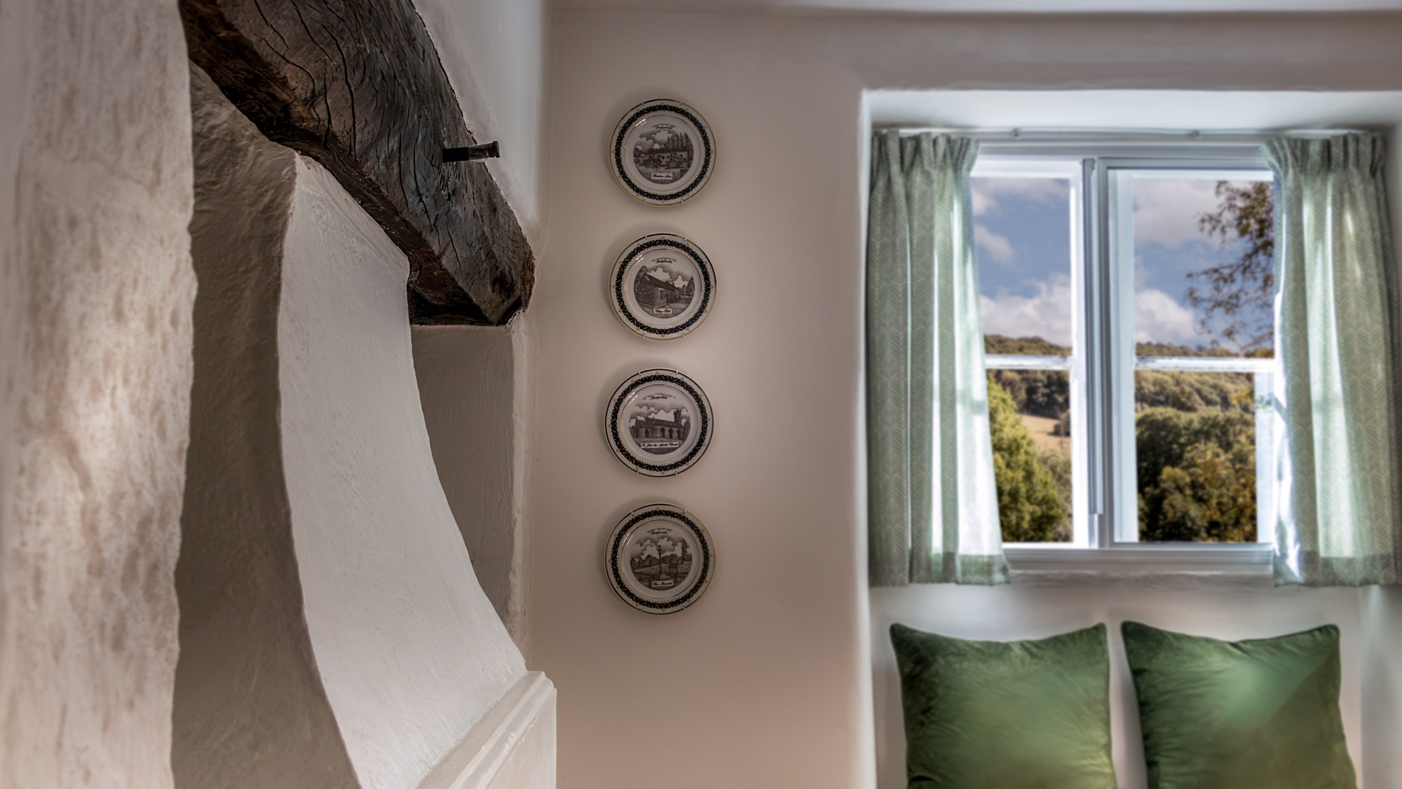 A close up of the inglenook in the open-plan sitting and dining room at Woody's Cottage, Gloucestershire