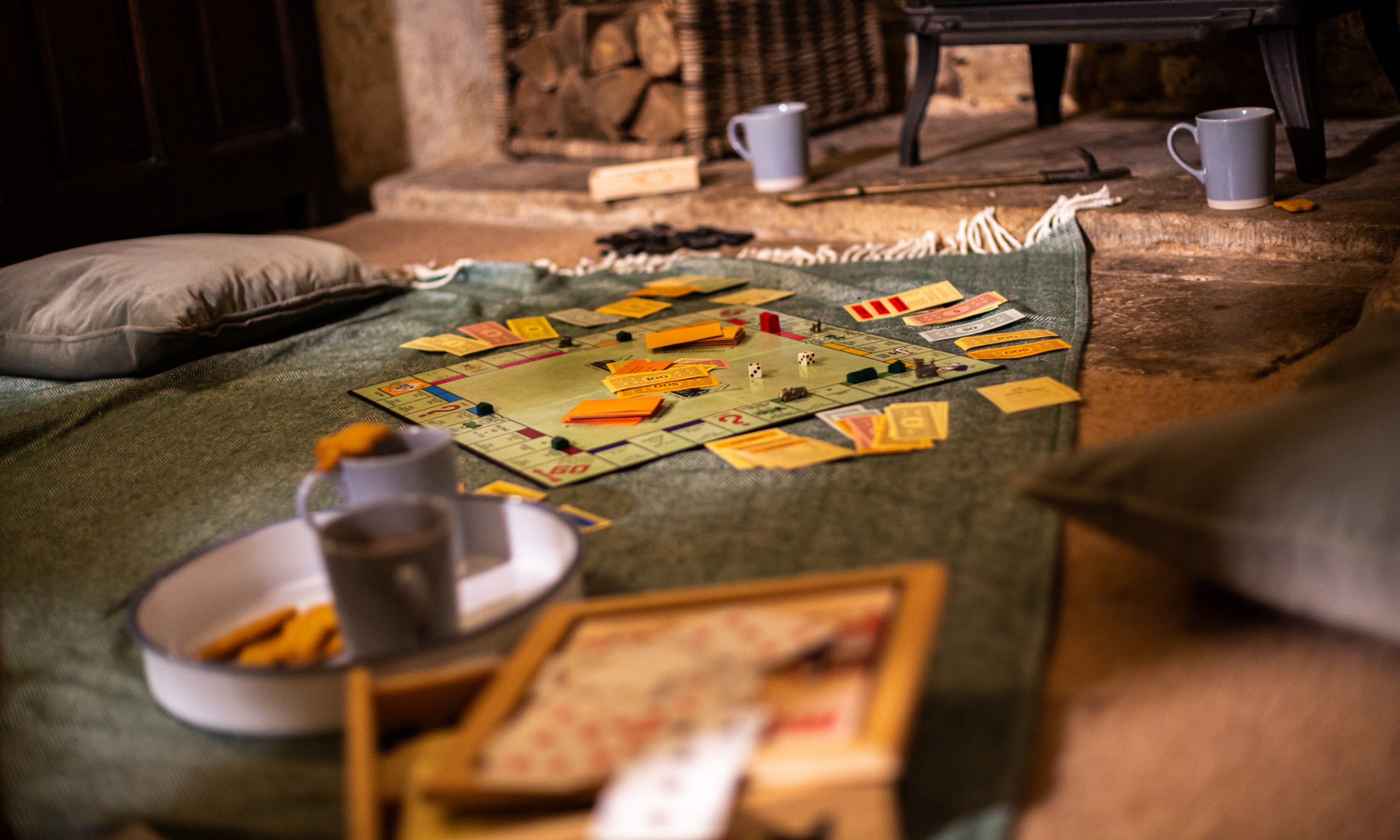 A game set up on the floor being played at a National Trust holiday cottage