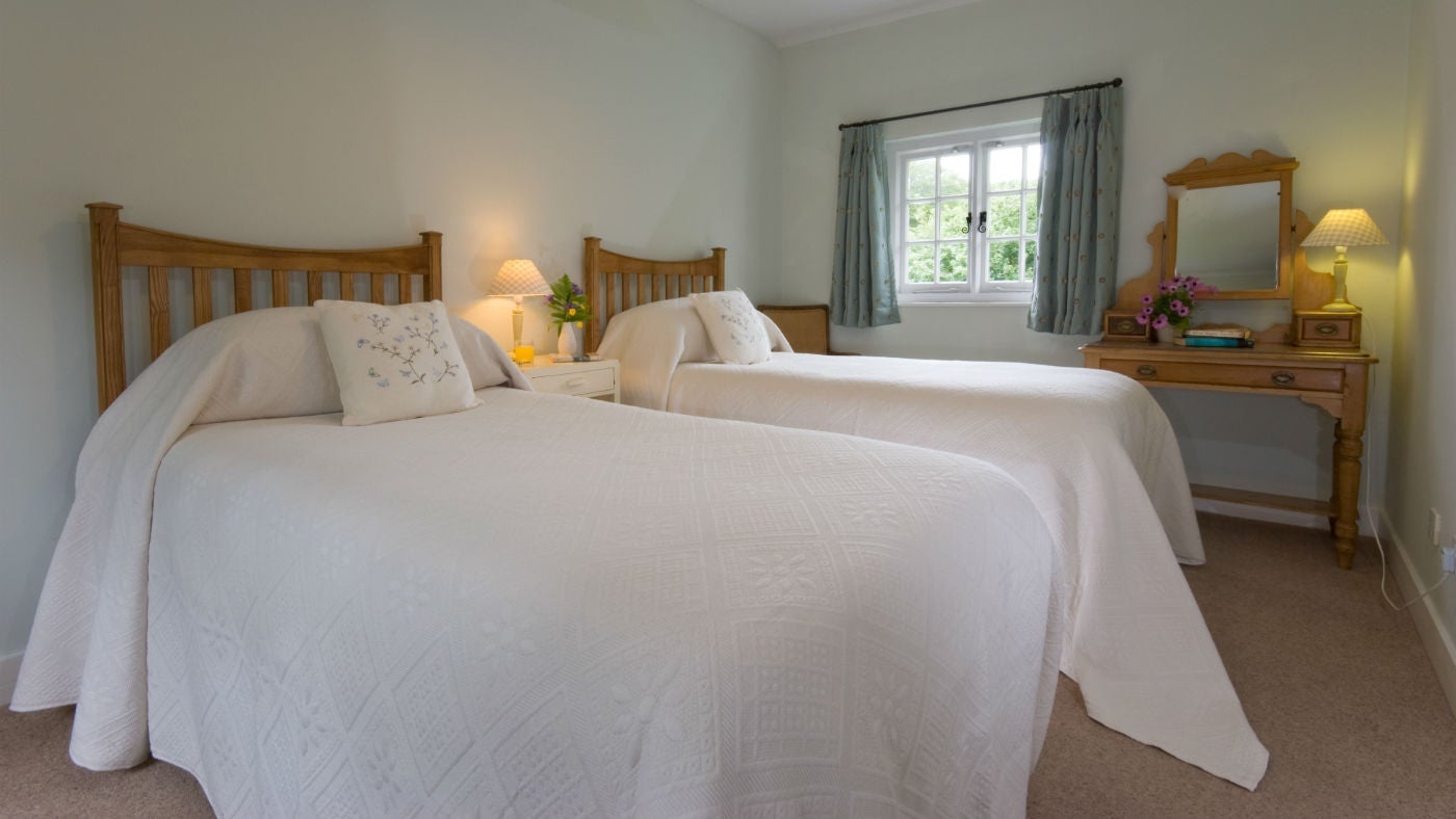 The large twin bedroom at 1 Coleton Barton, Kingswear, Devon