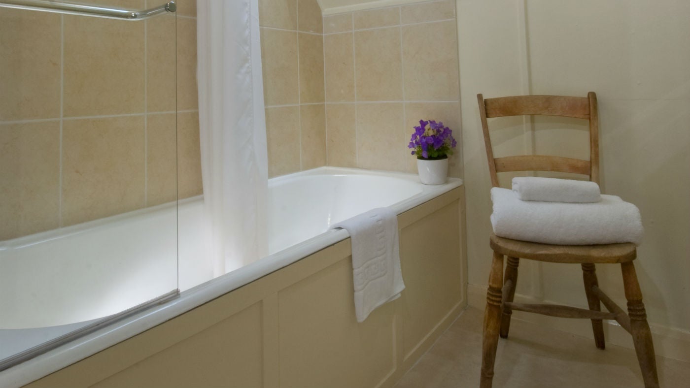 The bright bathroom at The Chauffeur's Flat, Coleton Fishacre, Devon