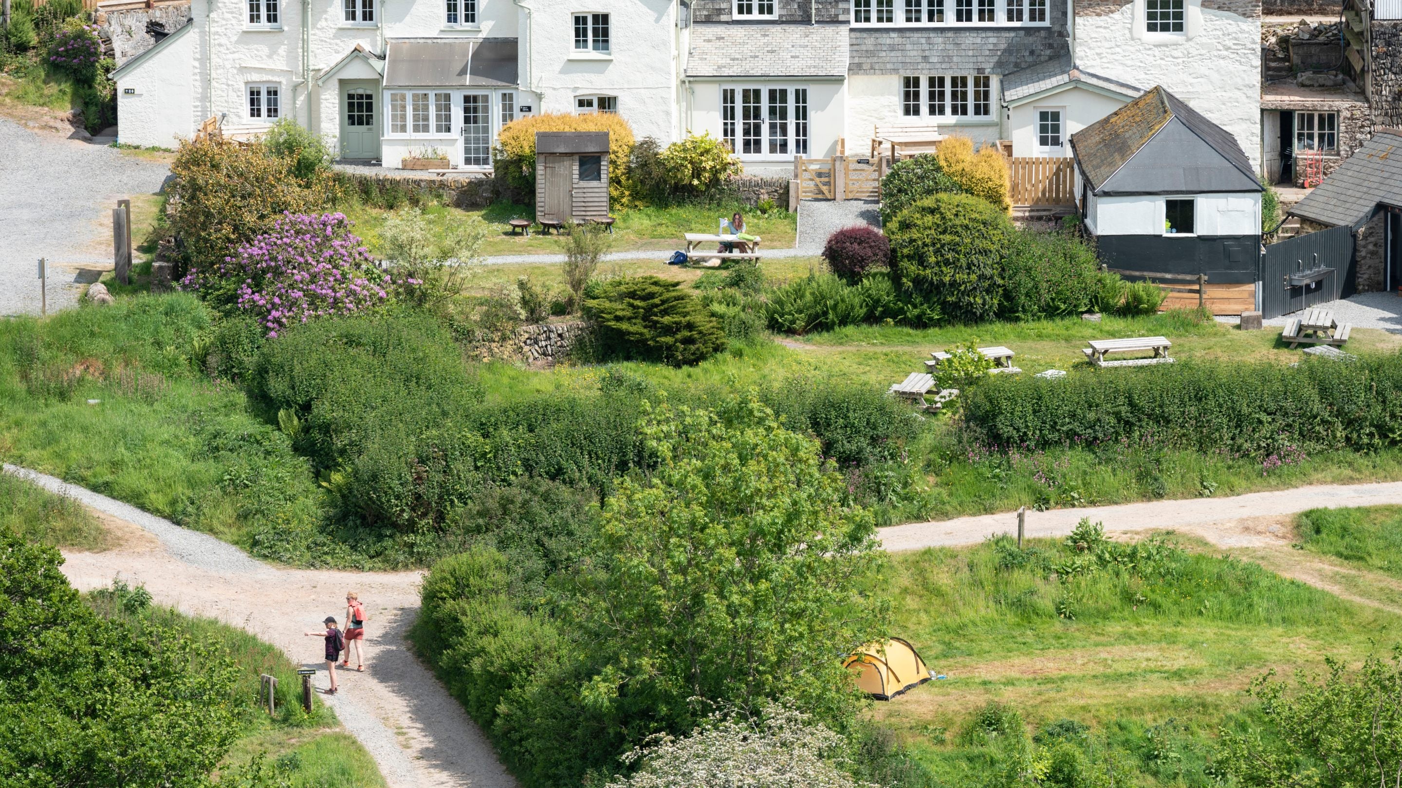 Carver Cottage, Cloud Farmhouse and the picnic area at Cloud Farm Campsite, Devon