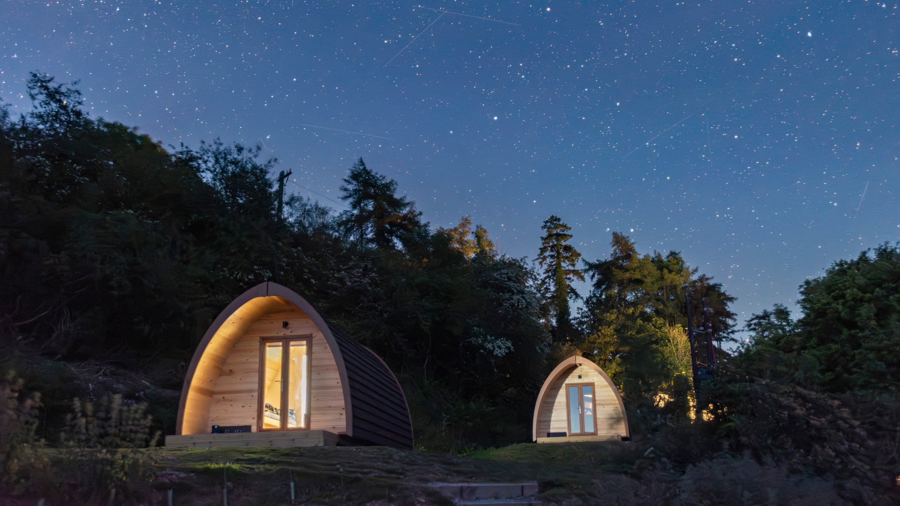 Pods at night at Cloud Farm Campsite, Devon