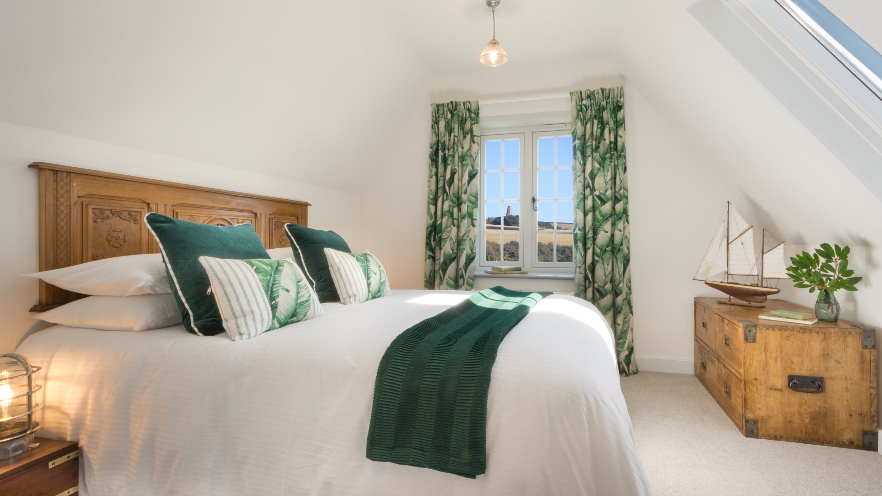 The second-floor double bedroom at Compass Cottage, Devon