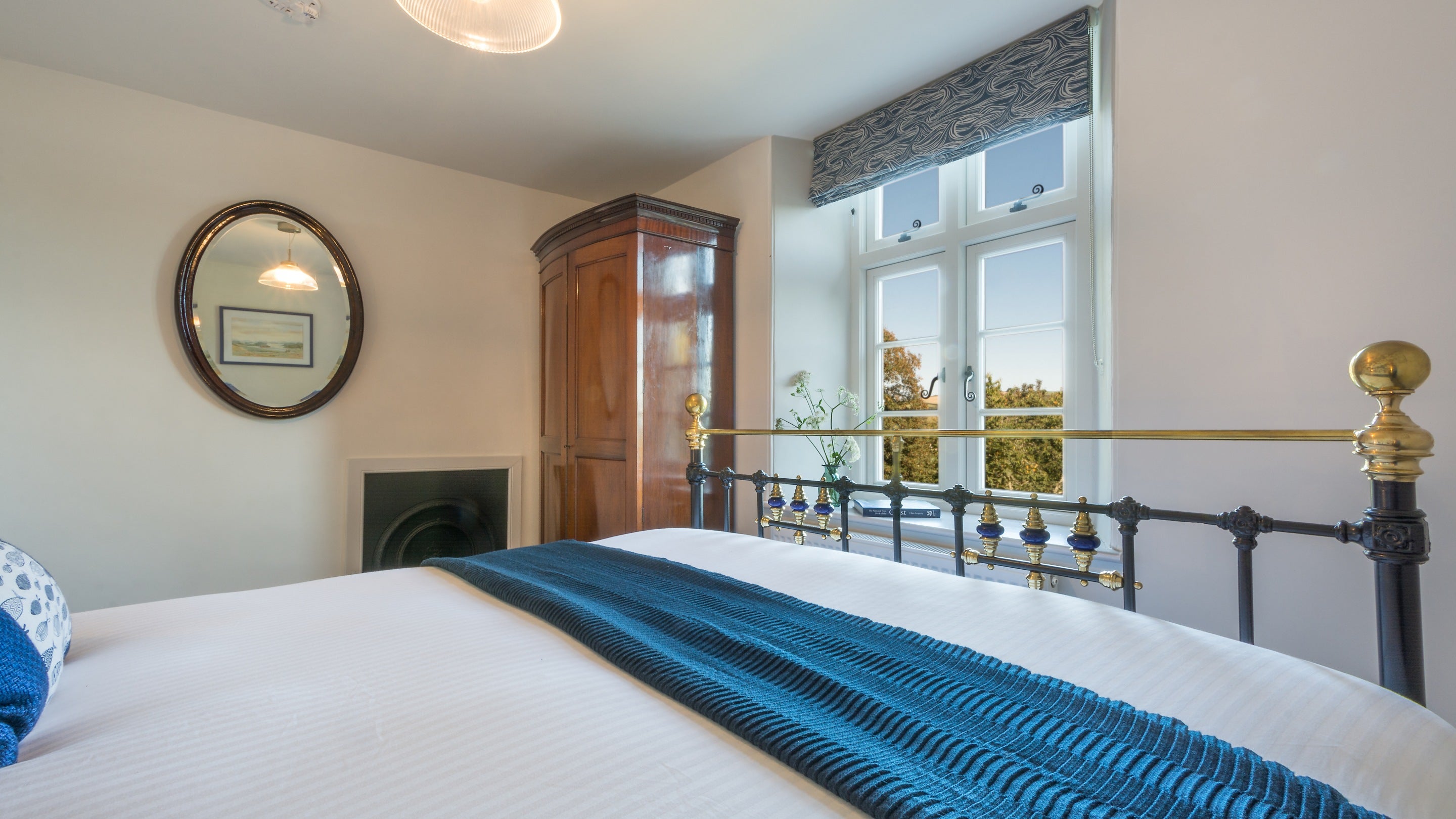 The first-floor double bedroom at Compass Cottage, Devon