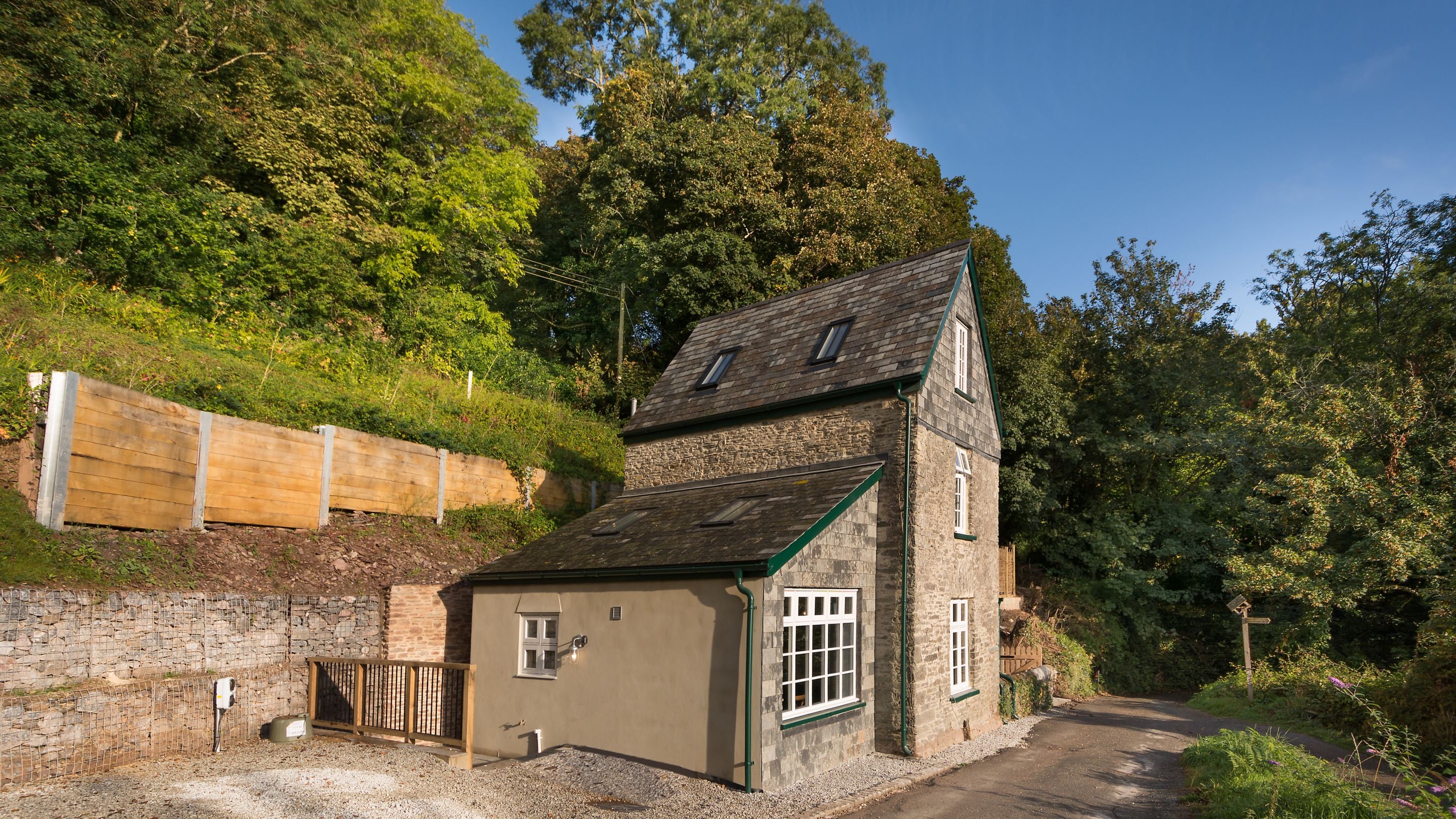 The exterior of Compass Cottage and its parking spaces, Devon